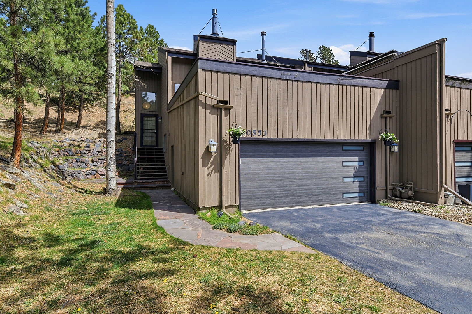 Front at 30553 Sun Creek Drive, Evergreen, CO 80439, listed by Michael Glunk