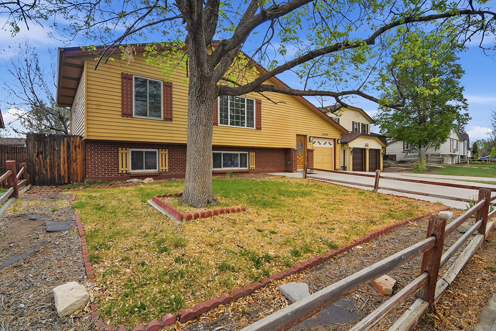 Front at 15969 East 18th Place, Aurora, CO 80011, listed by Carol Brohl