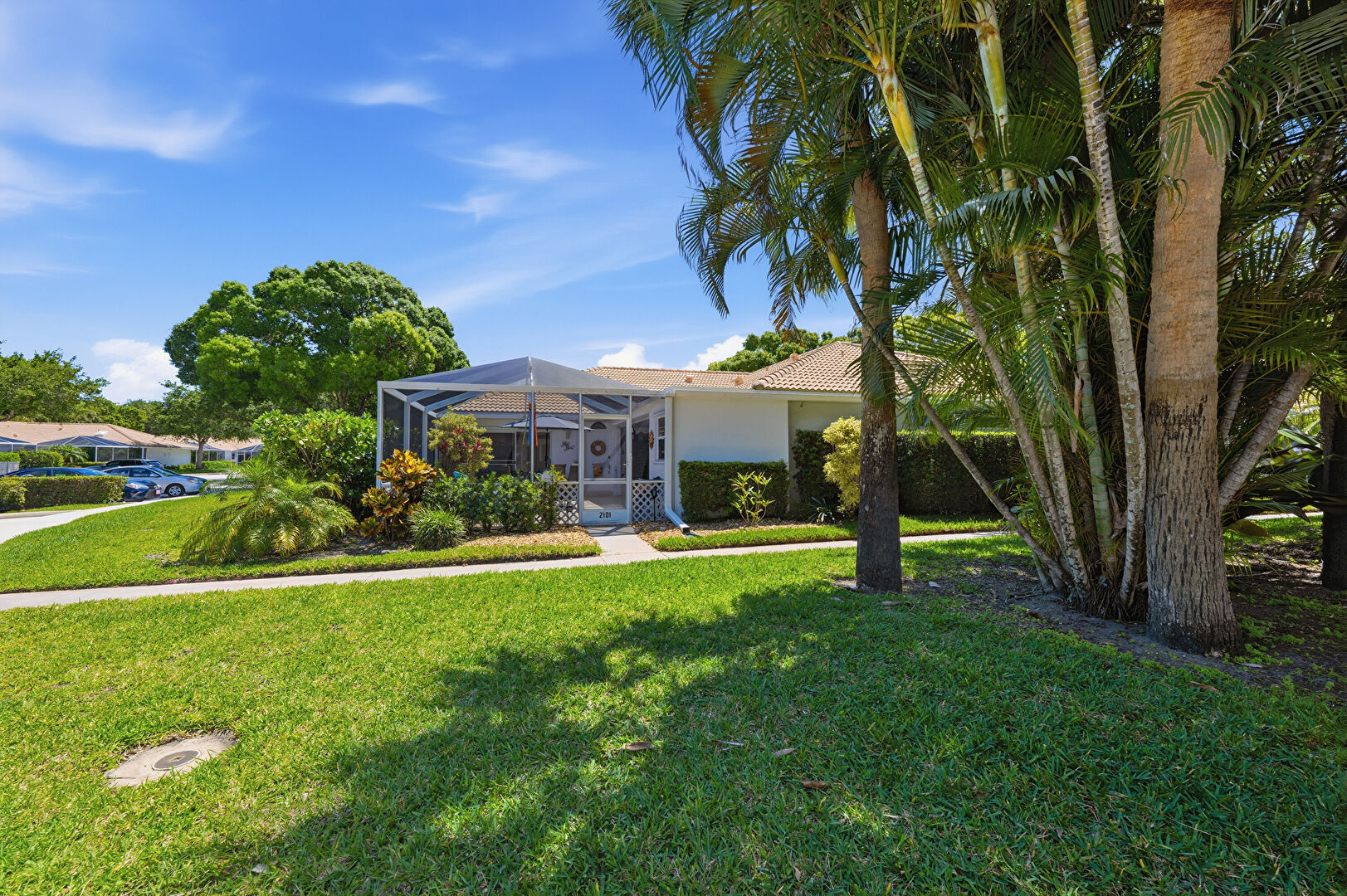 Front at 2101 Pin Oak Court, Palm Beach Gardens, FL 33410, listed by Lori Hobin