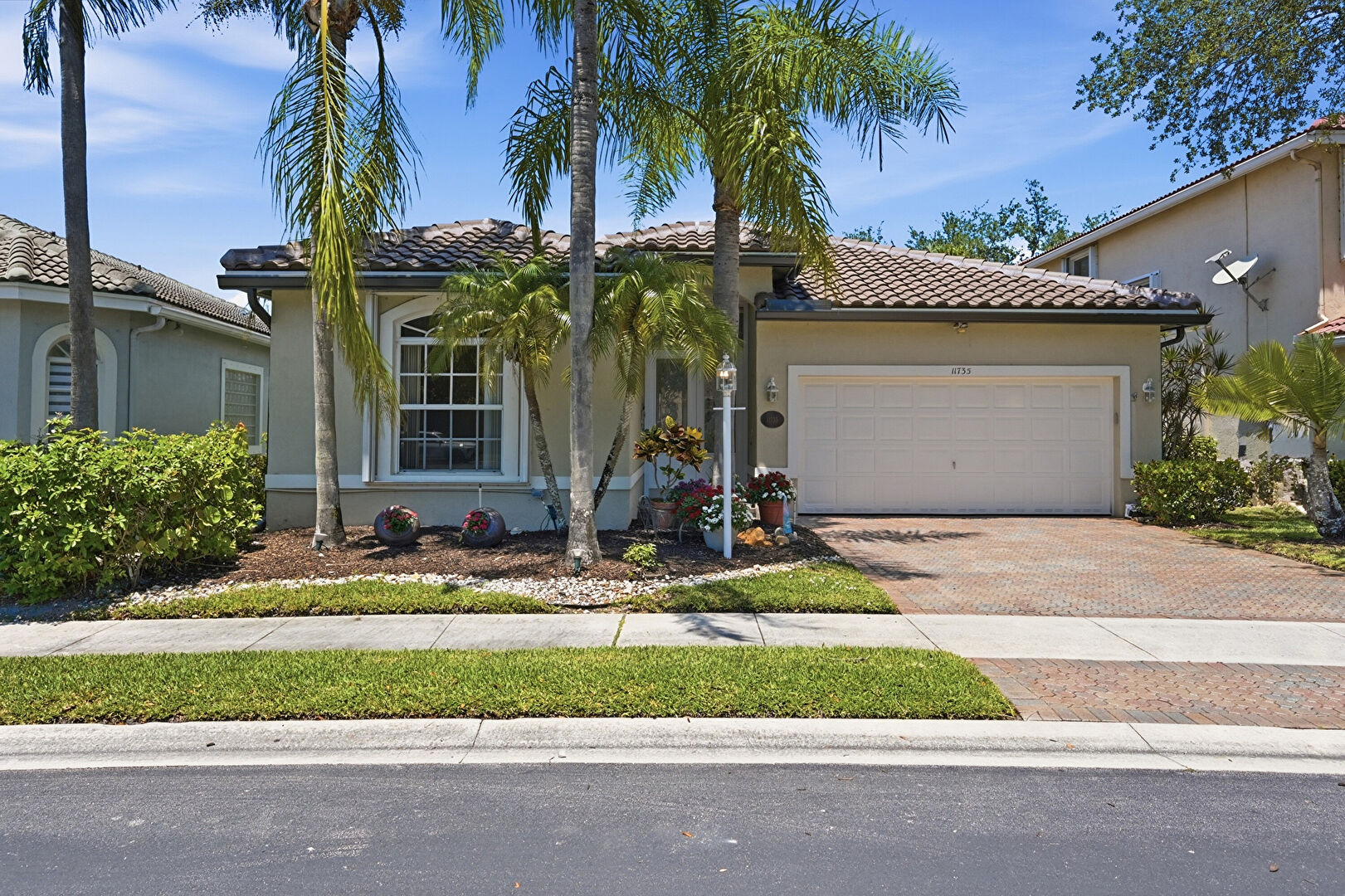 Front at 11735 NW 48th street, Coral Springs, FL 33076, listed by Laura Sanders