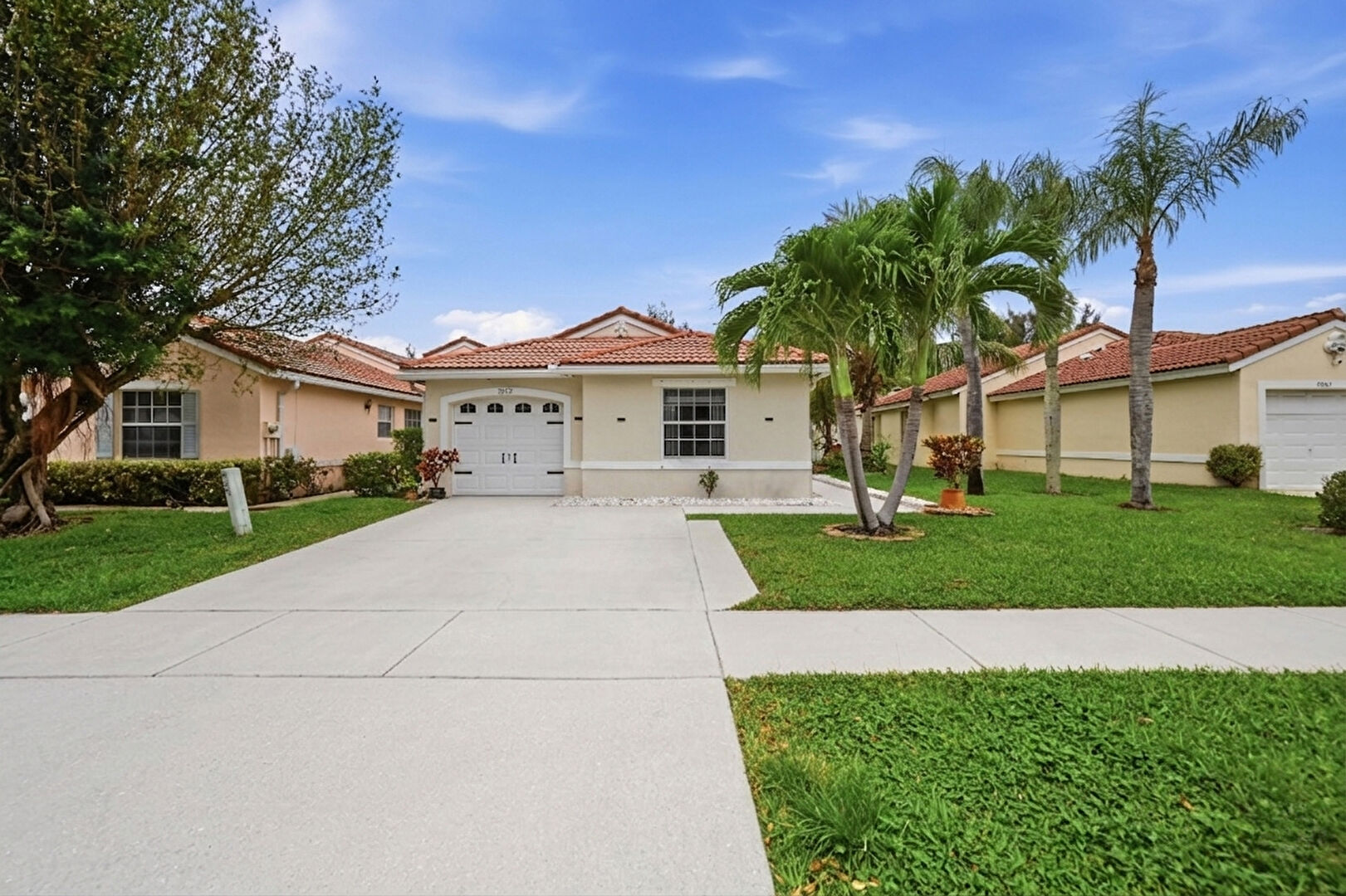 Front yard at 7069 Burgess Drive, Greenacres, FL 33467, listed by Chaddler (Chad) Williams