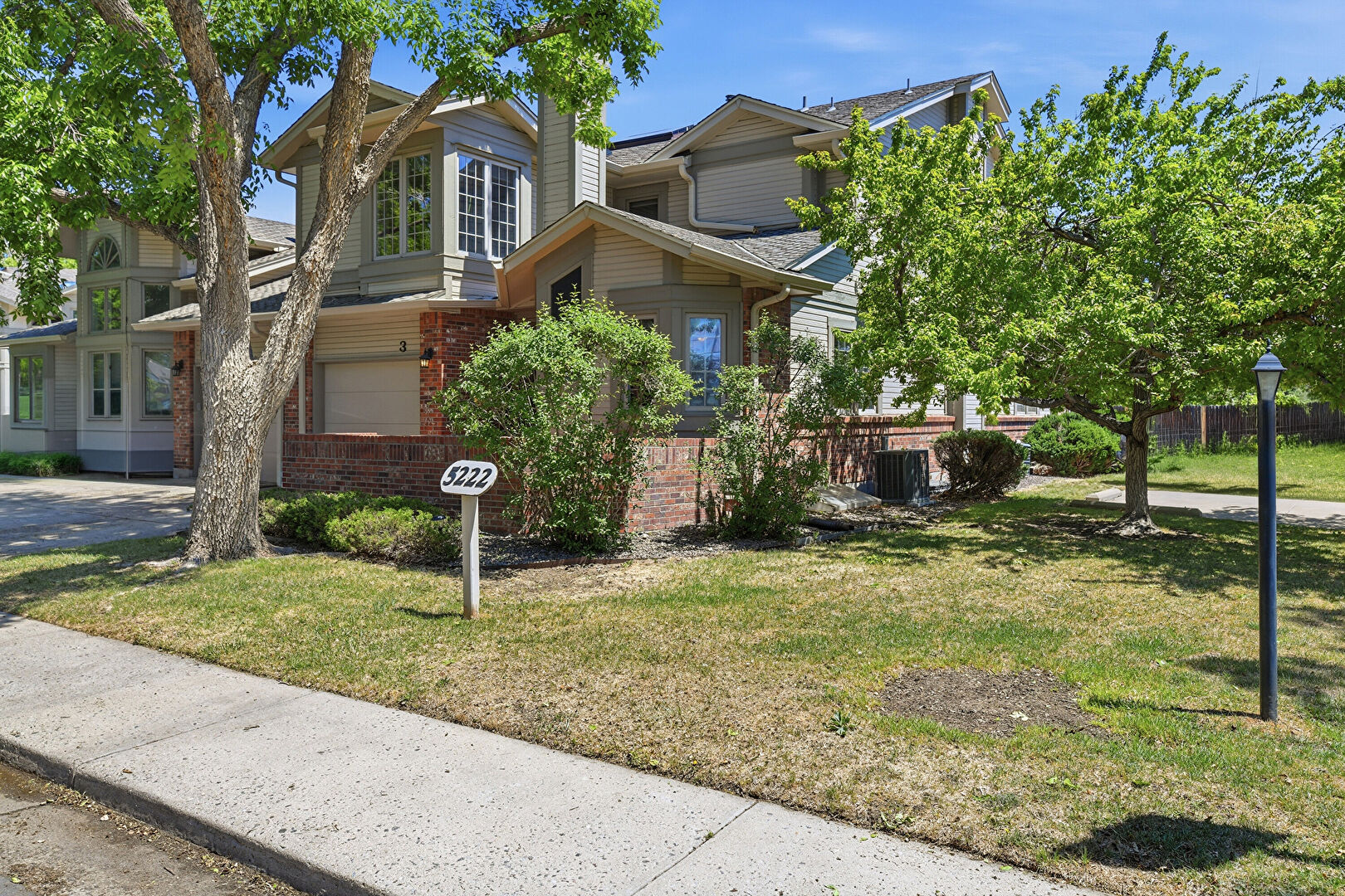 Front at 5222 Union Court unit 3, Arvada, CO 80002, listed by Sandi Hewins