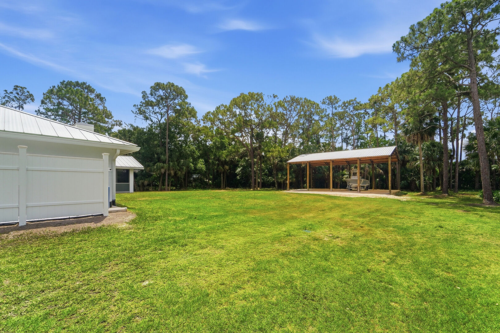 Backyard at 9662 Whippoorwill Trail, Jupiter, FL 33478, listed by Milva Skorish