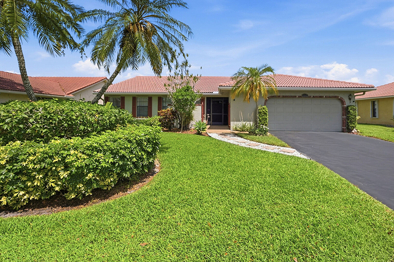 Front at 1042 Northwest 110th Lane, Coral Springs, FL 33071, listed by Laura Sanders