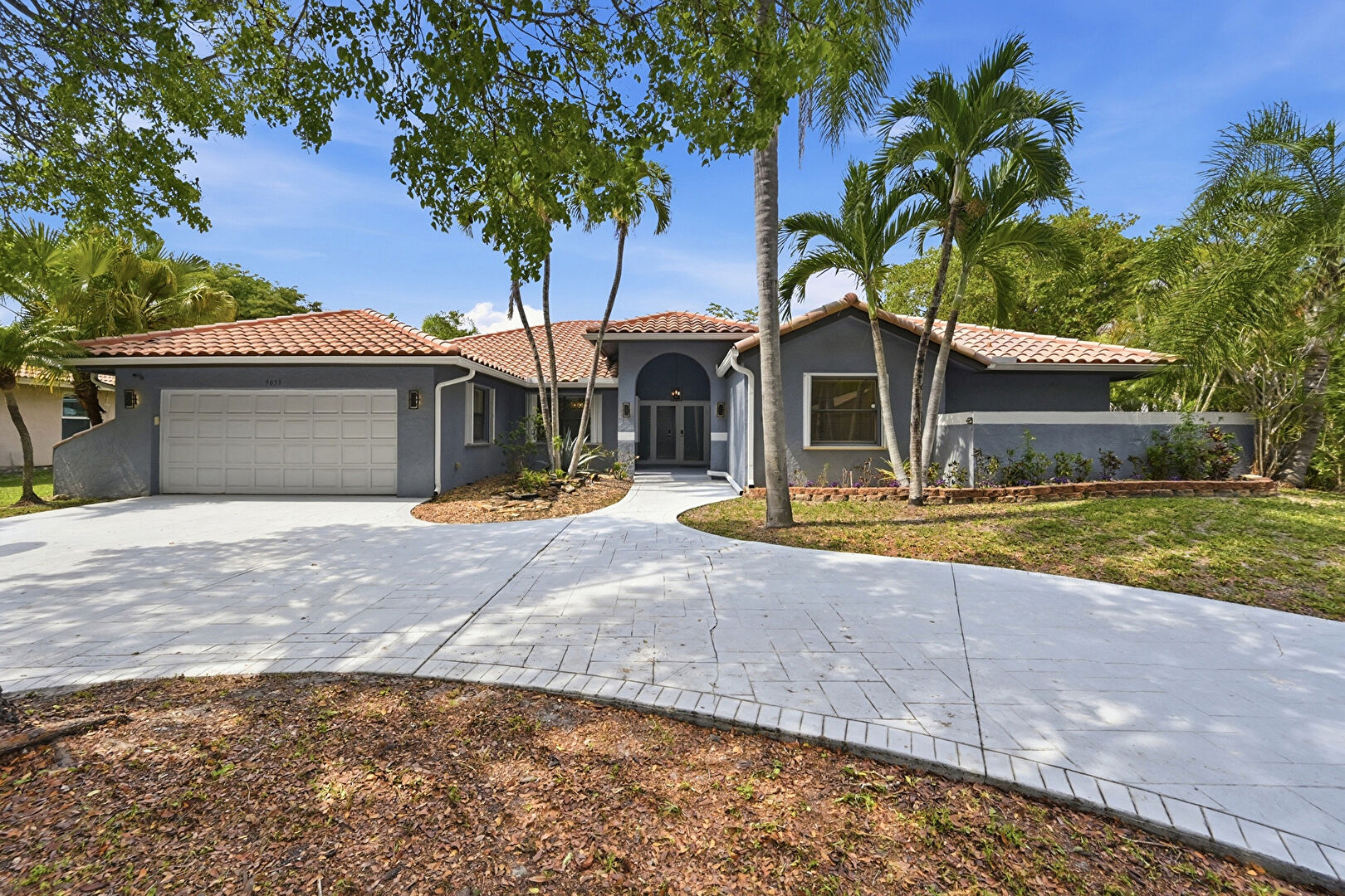 Front at 9033 Northwest 47th Court, Coral Springs, FL 33067, listed by Laura Sanders