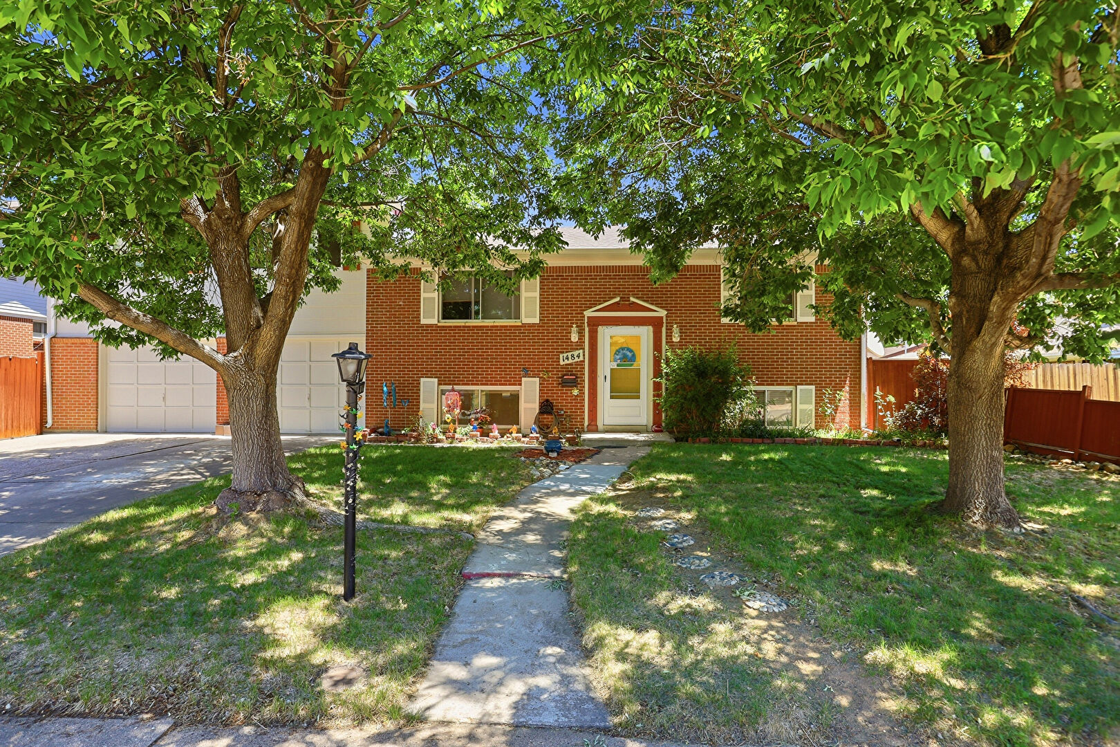 Front at 1484 South Balsam Court, Lakewood, CO 80232, listed by Jaylyn Heartso