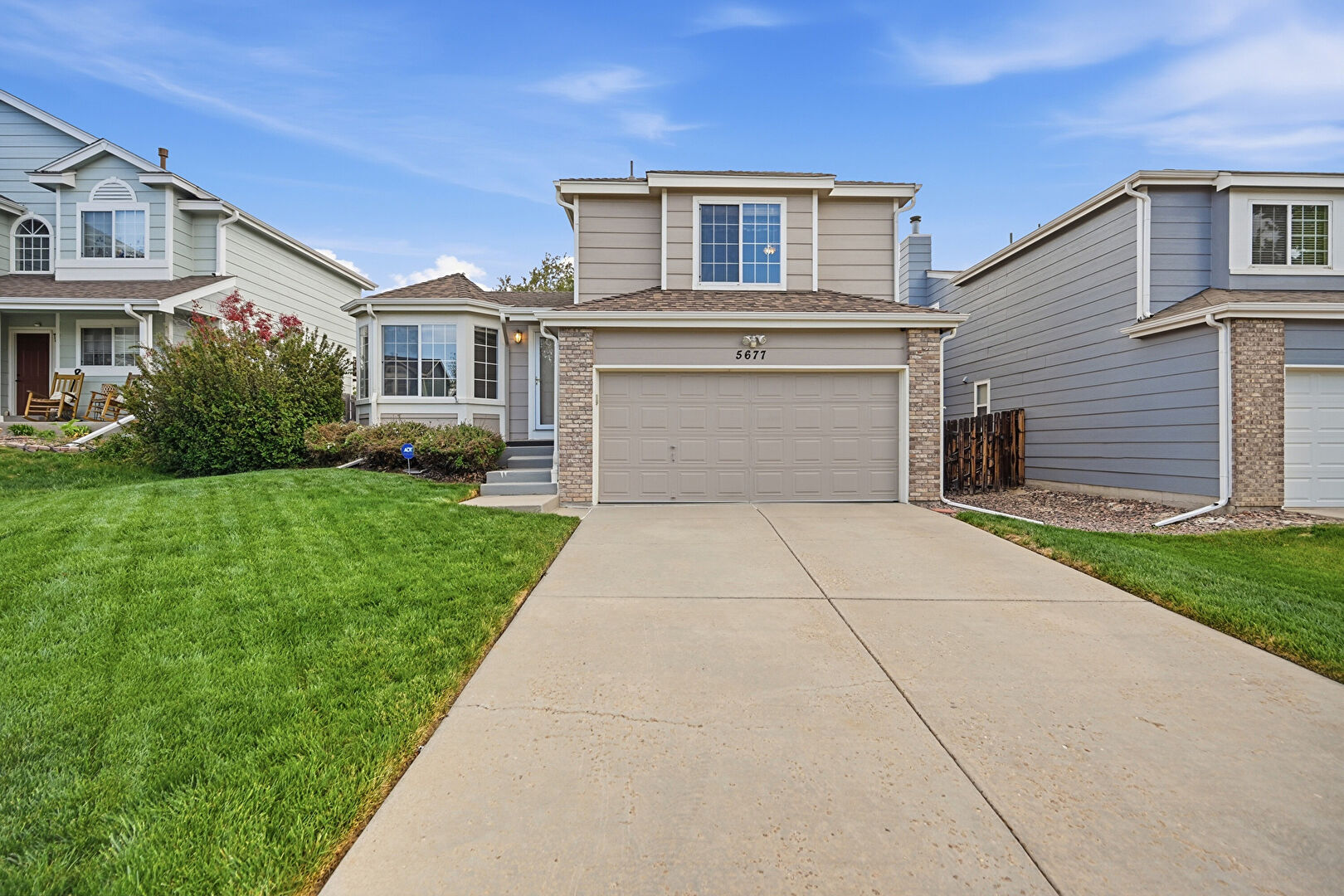Front at 5677 South Jericho Way, Centennial, CO 80015, listed by Lorrie and Troy Lucero