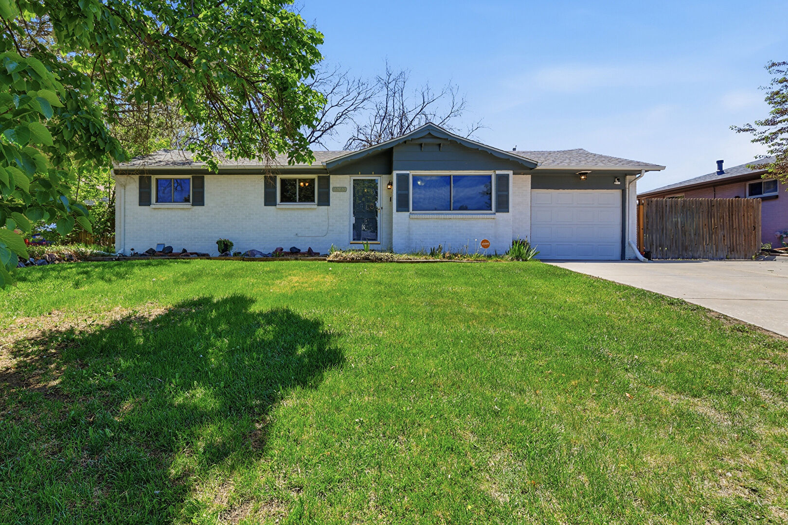 Front at 12120 East Center Drive, Aurora, CO 80012, listed by Mike & Ed Hardey