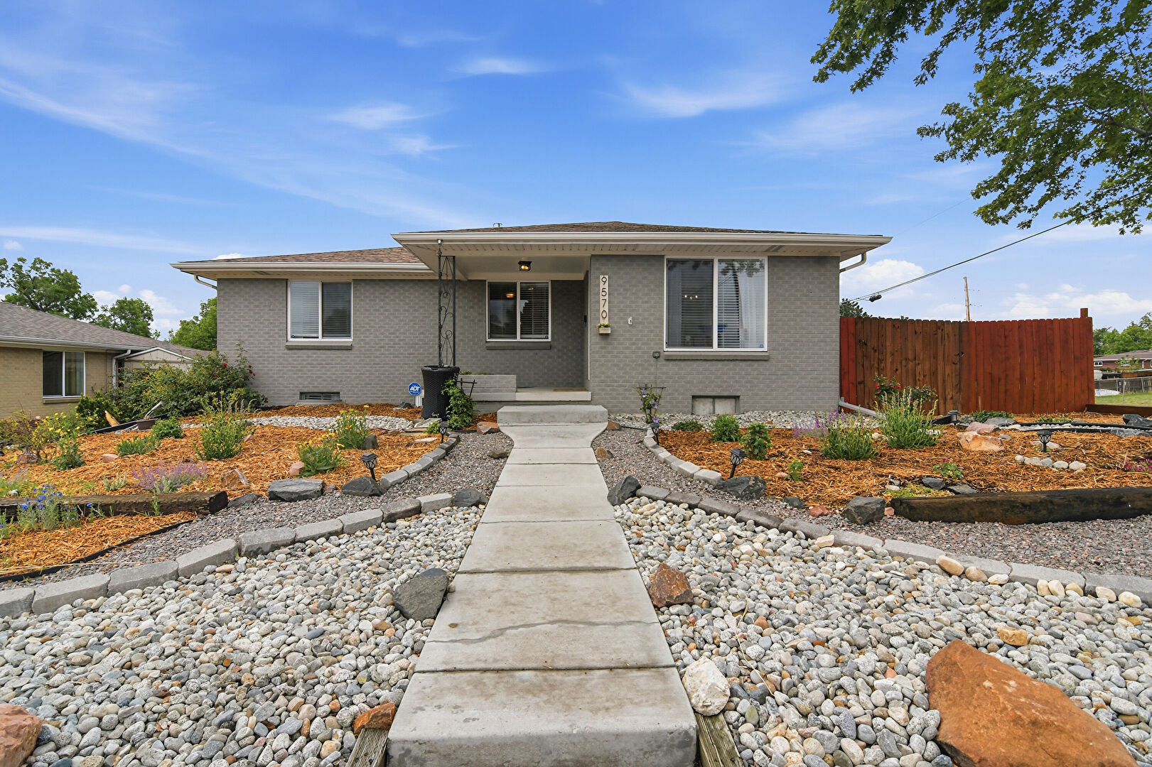 Front at 9570 West 54th Place, Arvada, CO 80002, listed by Jim Casey