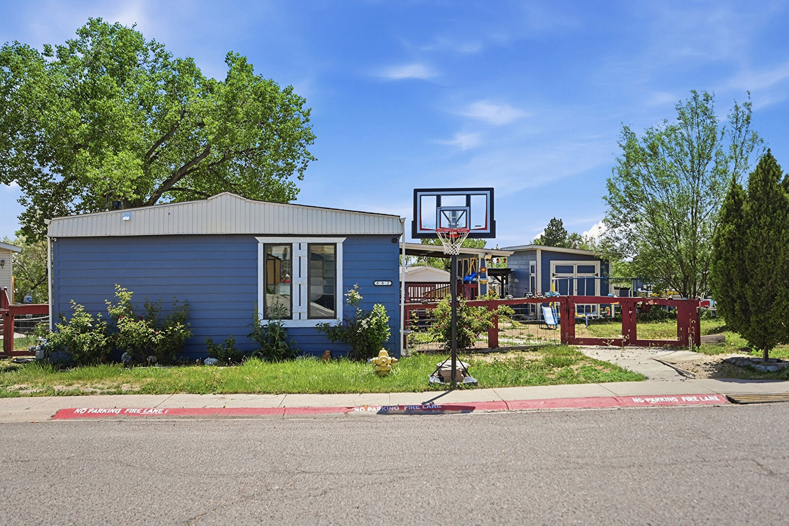 Front at 4210 East 100th Avenue Lot 662, Thornton, CO 80229, listed by Nancy Leon Barreras