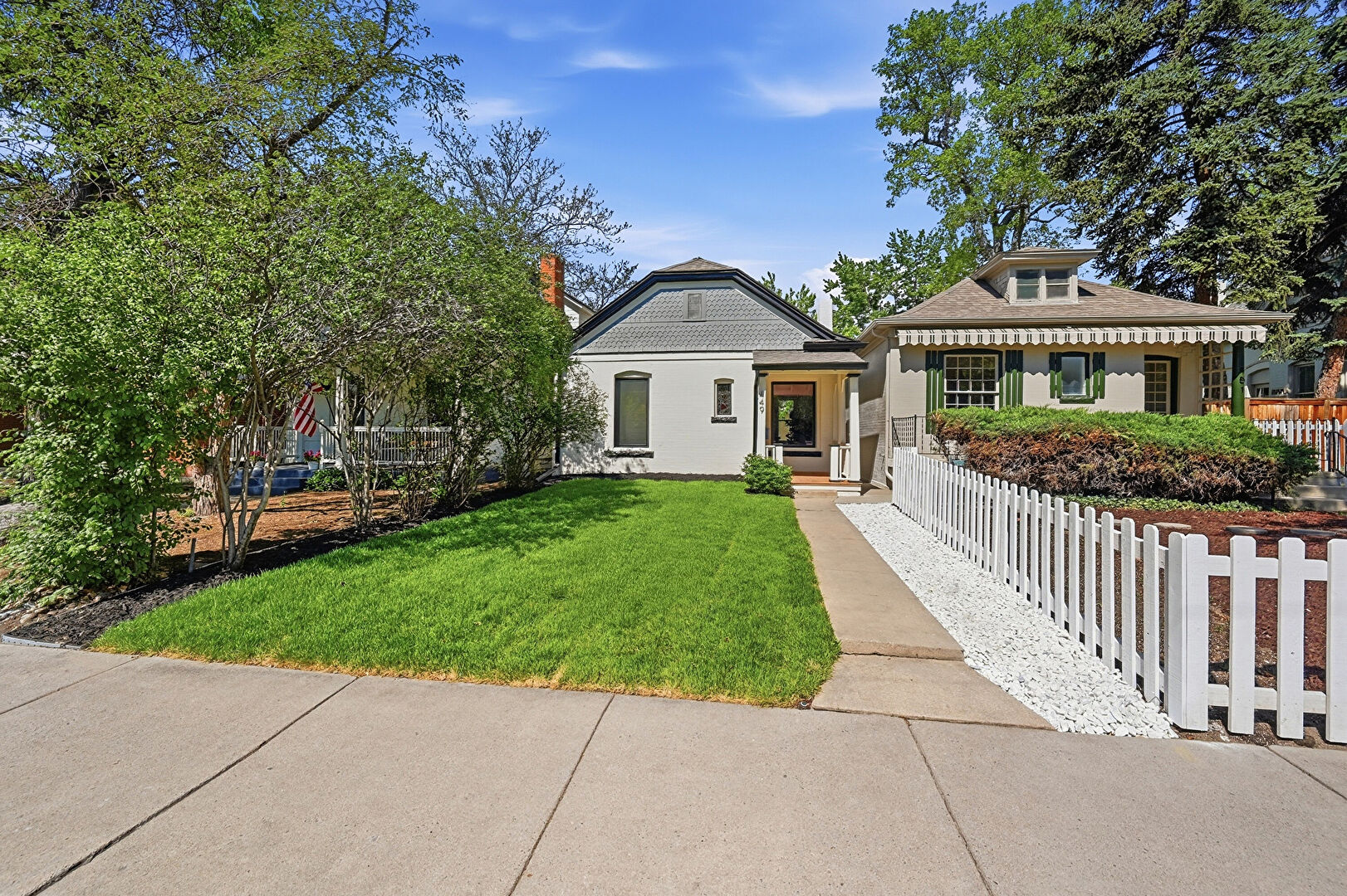 Front at 449 Corona Street, Denver, CO 80218, listed by Julio Quezada