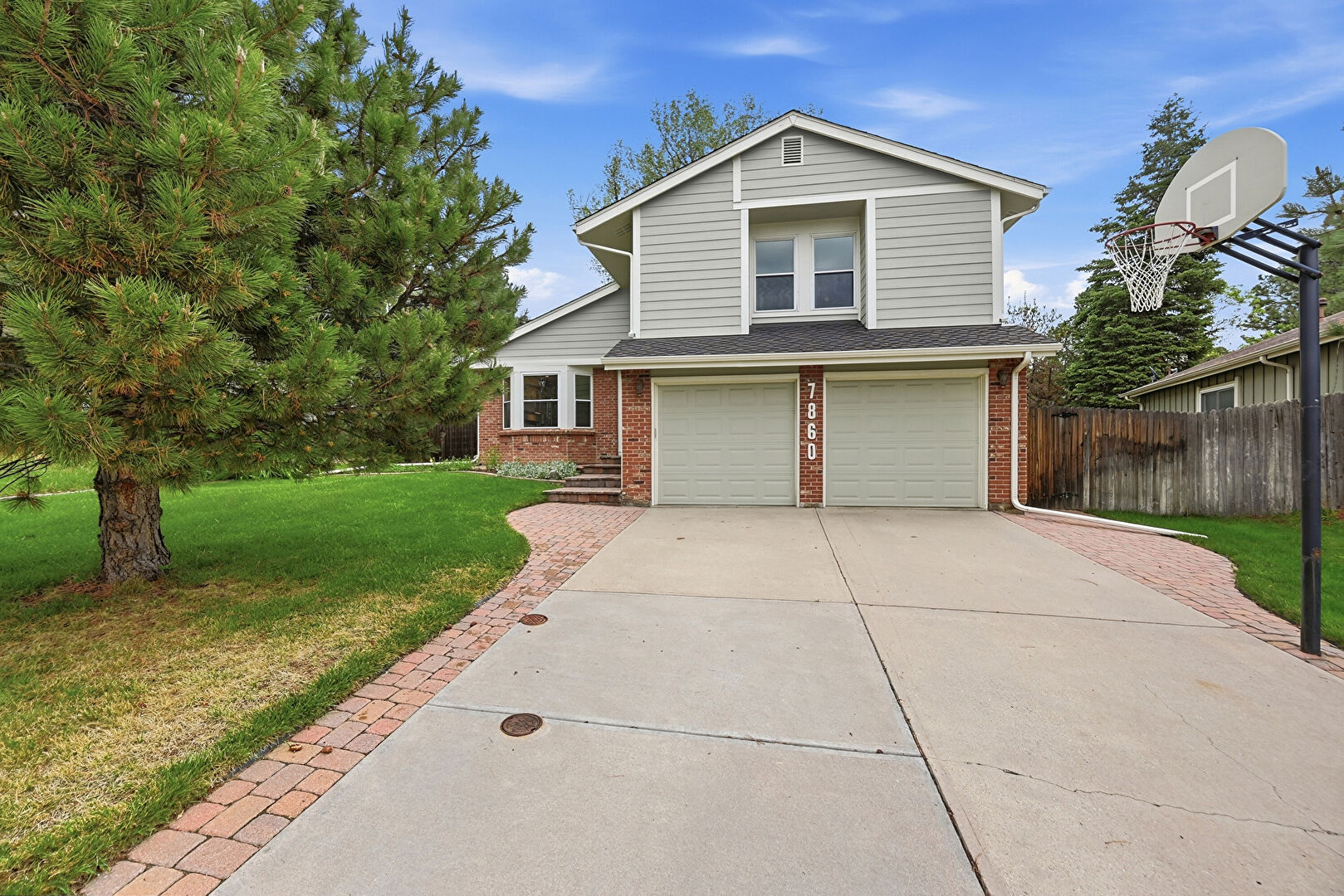 Front at 7860 South Trenton Street, Centennial, CO 80112, listed by Elizabeth Degraffenried
