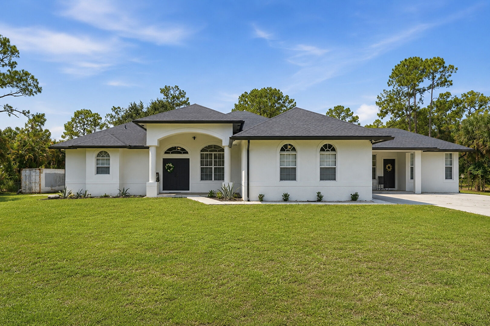 Front at 18220 90th Street North, The Acreage, FL 33470, listed by Elizabeth Londono