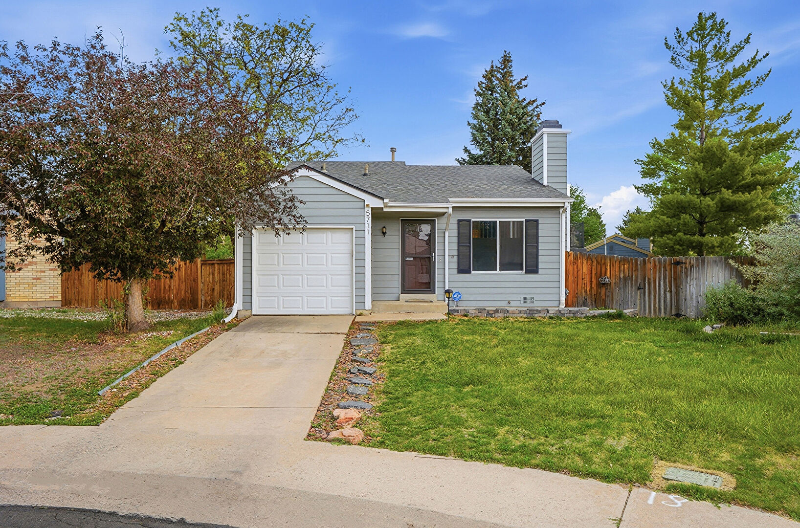 Front at 5711 West 76th Avenue, Arvada, CO 80003, listed by Taylor Haas