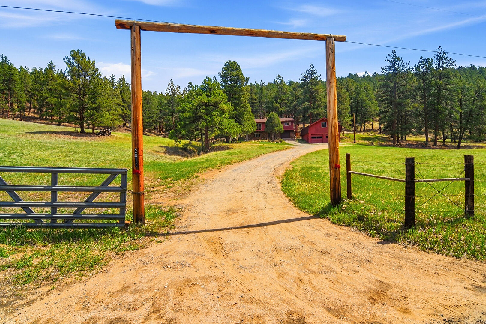 Front Driveway Entrance at 2830 Kerr Gulch Road, Evergreen, CO 80439, listed by Fred Baxter