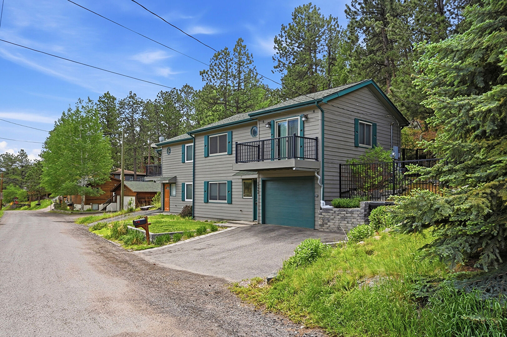 Front at 29888 Aspen Lane, Evergreen, CO 80439, listed by Sandra Bosworth