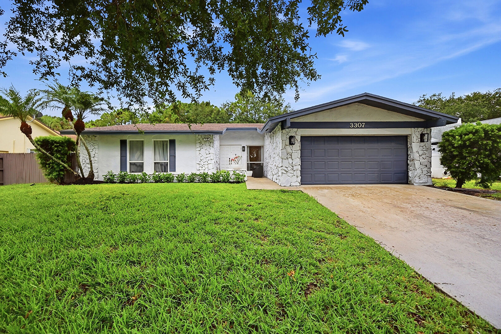 Front at 3307 Northwest 29th Avenue, Boca Raton, FL 33434, listed by Laura Sanders