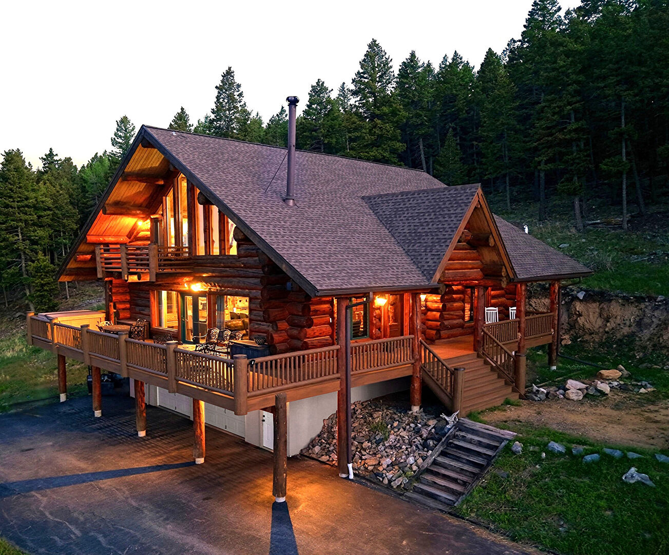 Front & Driveway Side at 25504 Mountain Moss Court, Evergreen, CO 80439, listed by Michele Lewis, MLS ID: 2253516