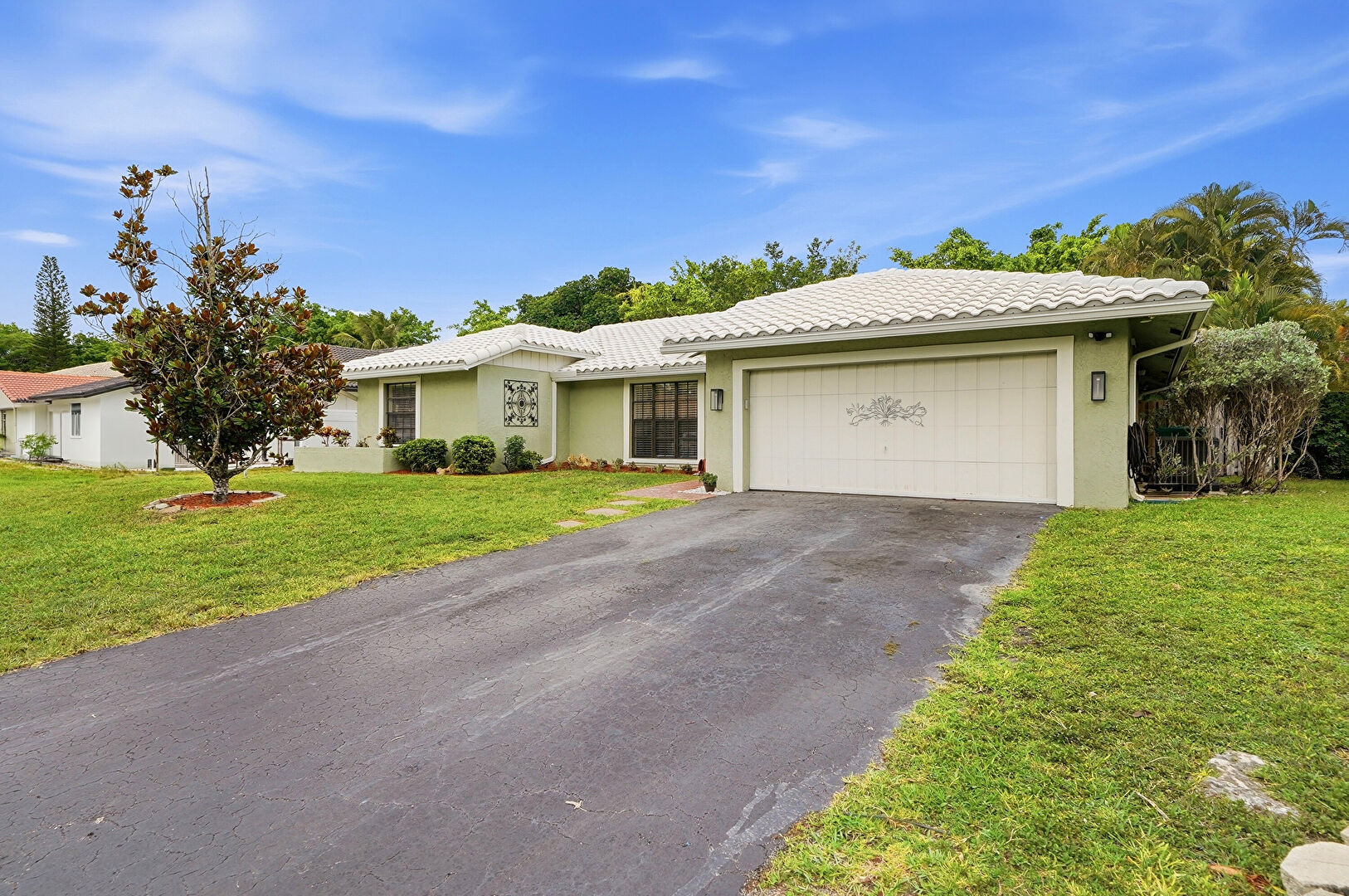 Front at 2145 Northwest 85th Lane, Coral Springs, FL 33071, listed by Laura Sanders