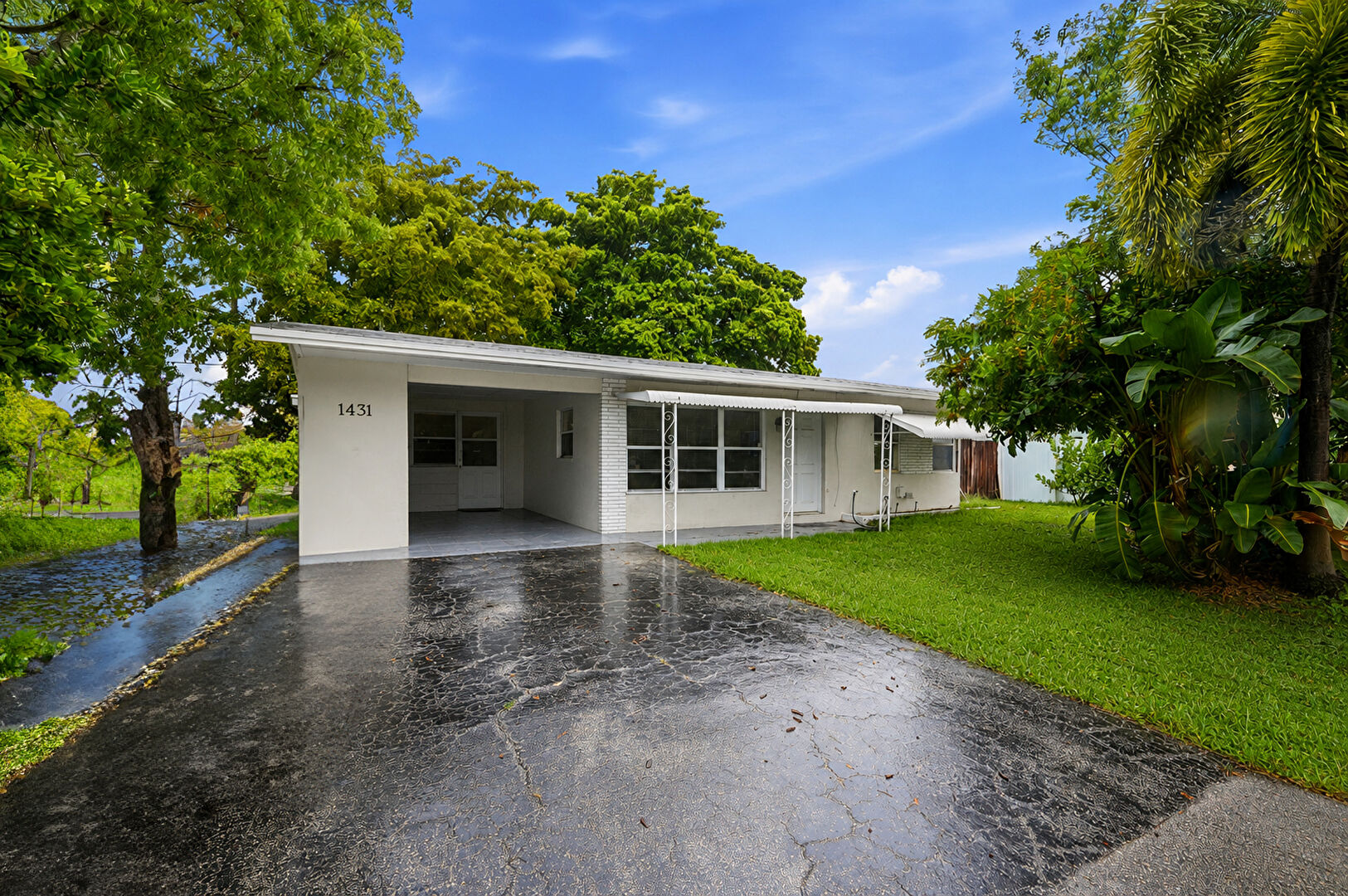 Front at 1431 Northeast 32nd Street, Pompano Beach, FL 33064, listed by Katherine Lizana