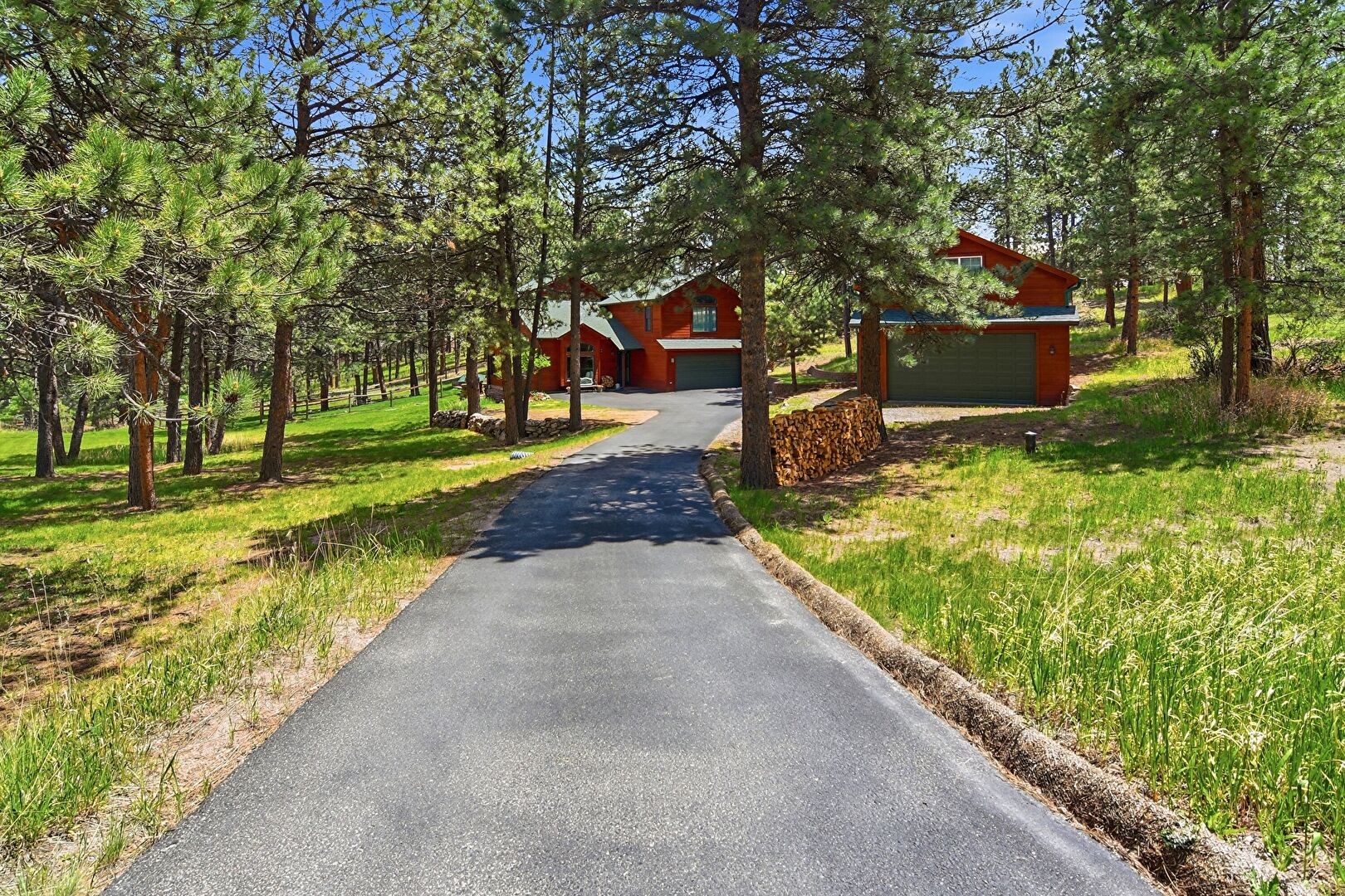 Front Yard and Driveway at 30 Impala Trail, Bailey, CO 80421, listed by Jenny Penman