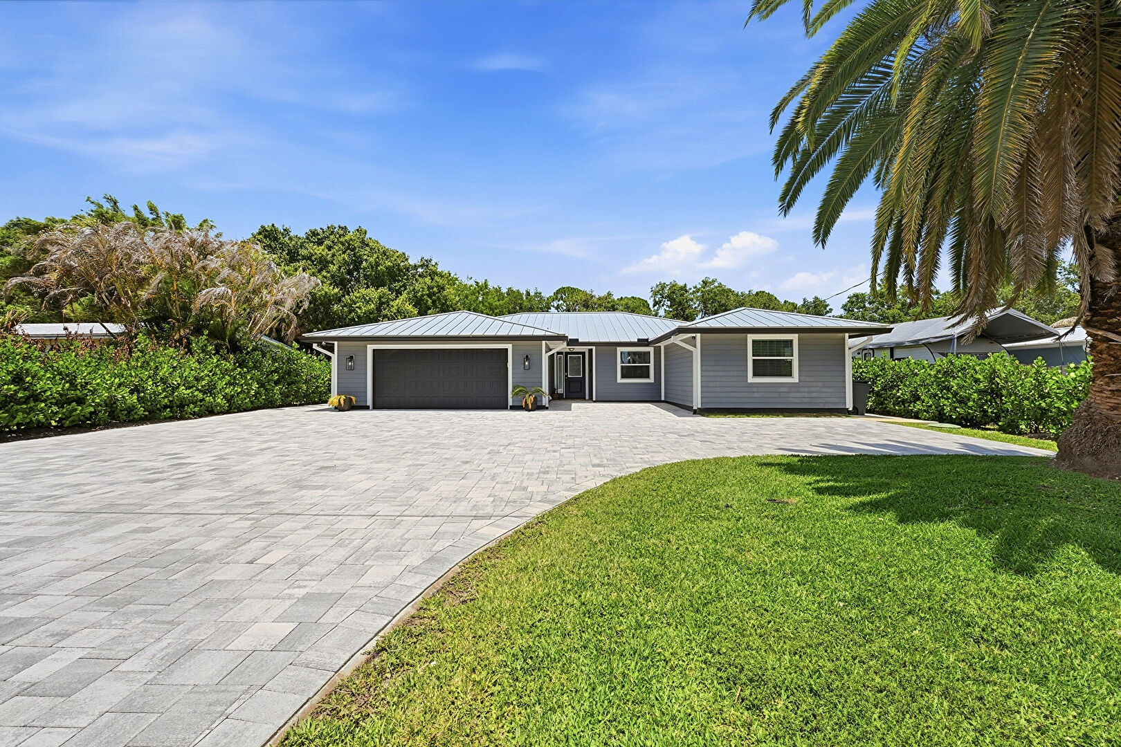 Front at 1409 Southwest Ibis Street, Palm City, FL 34990, listed by Jason M Coley