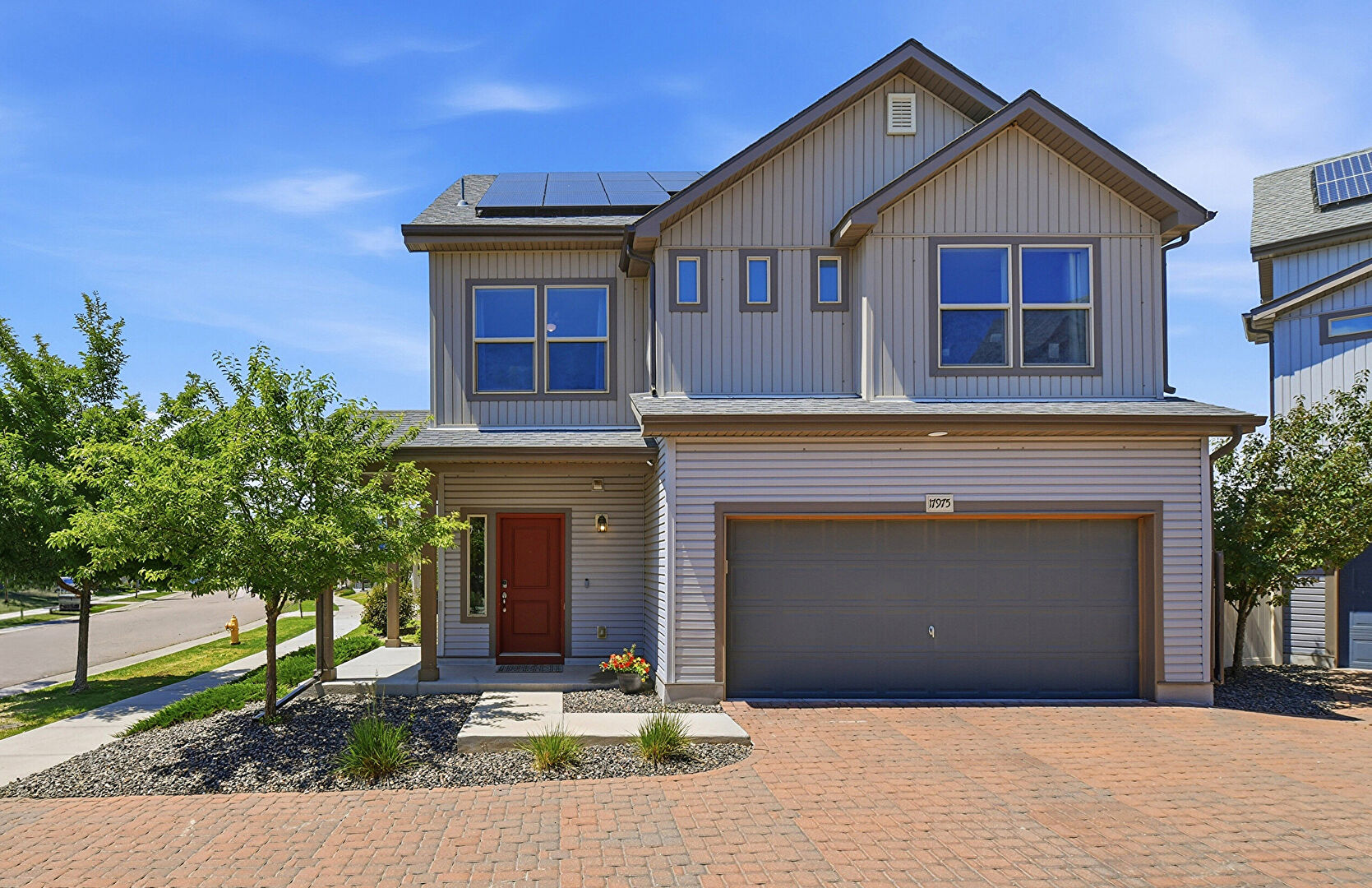 Front at 17975 East 54th Avenue, Denver, CO 80249, listed by Kristen White