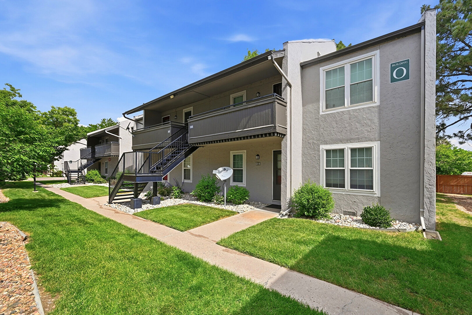 Front at 7110 South Gaylord Street, Bldg O Unit #7, Centennial, CO 80122, listed by Cesar Pena