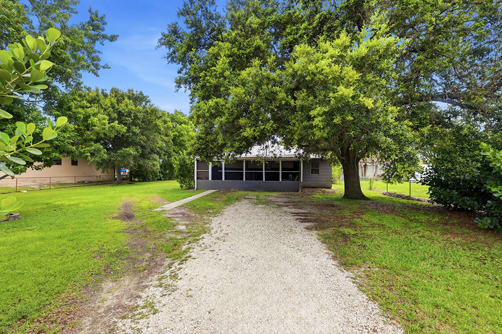 Front yard at 133 2nd Street, Naples, FL 34113, listed by Mark Vancosky
