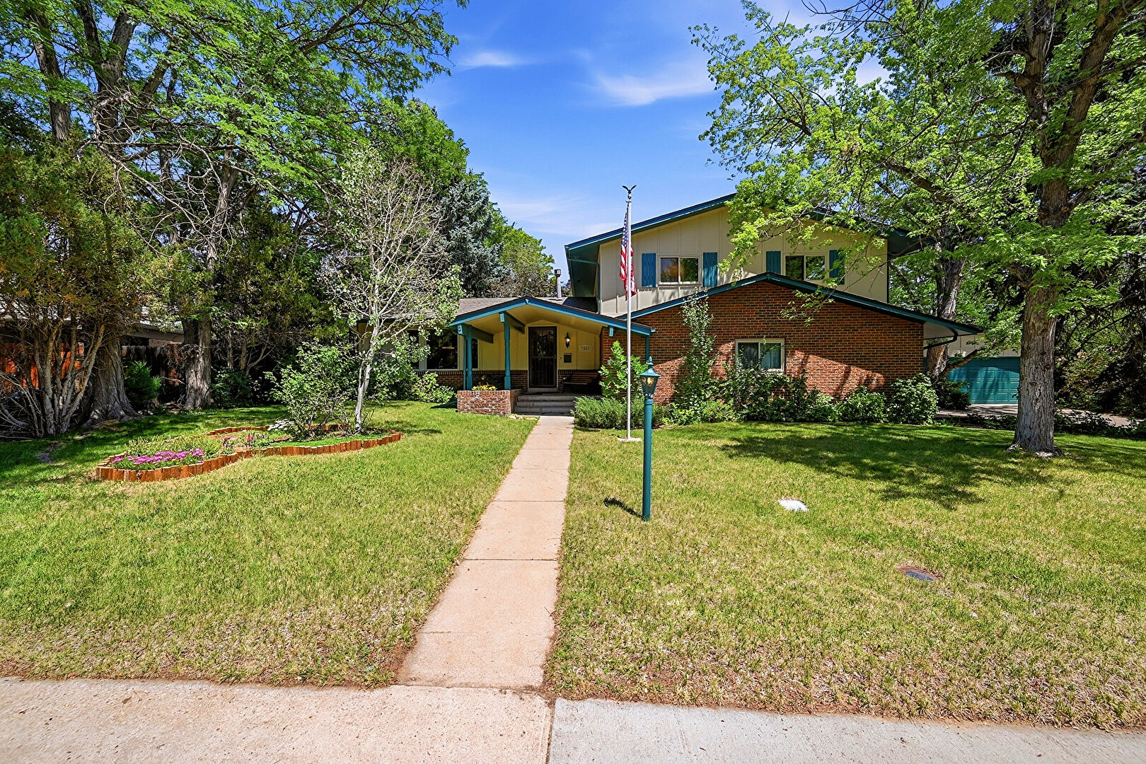 Front at 7582 South Ames Way, Littleton, CO 80128, listed by Diane Florschuetz