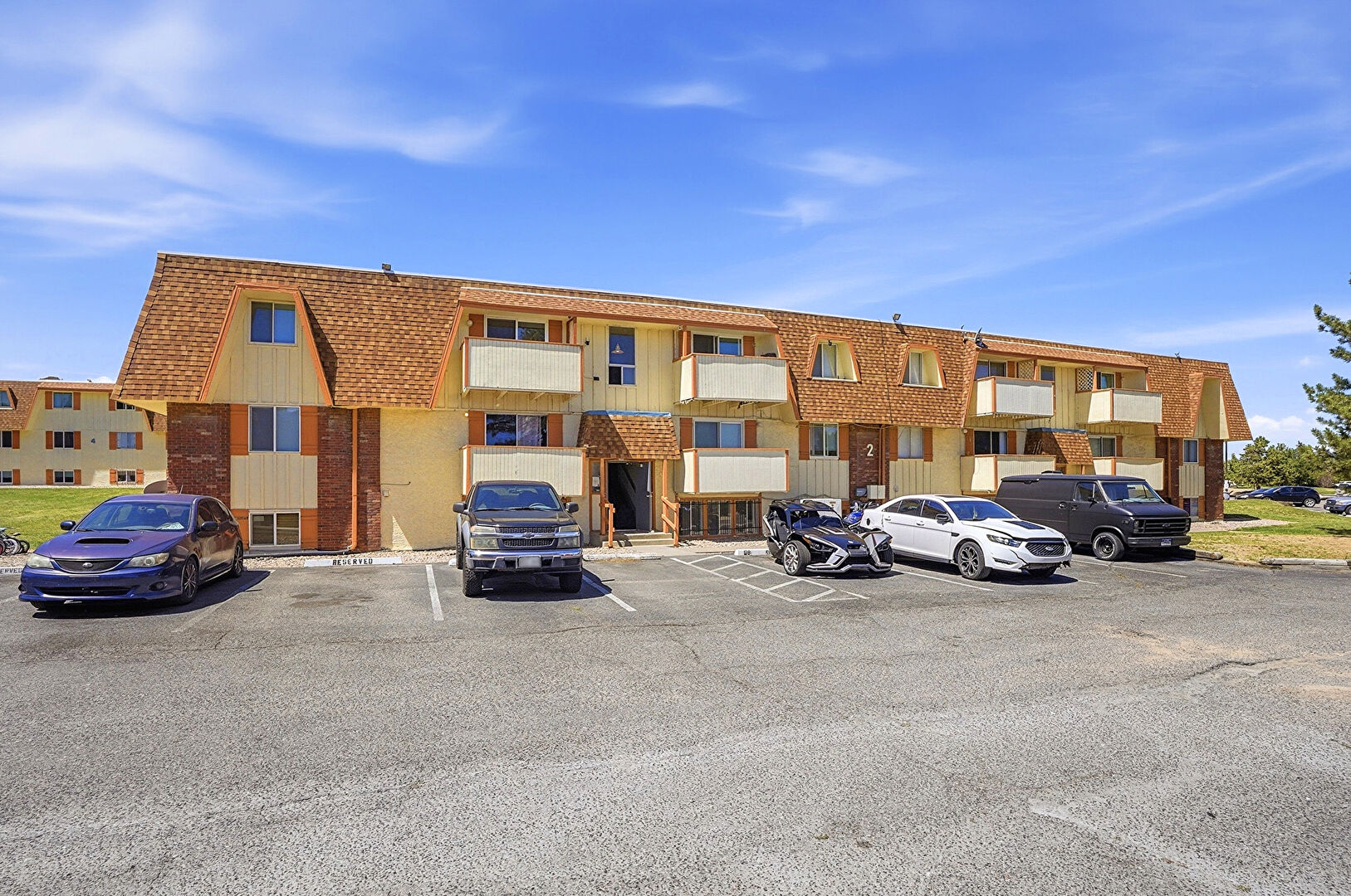 Front at 10211 Ura Lane, 2-104, Thornton, CO 80260, listed by Nicole Sabo