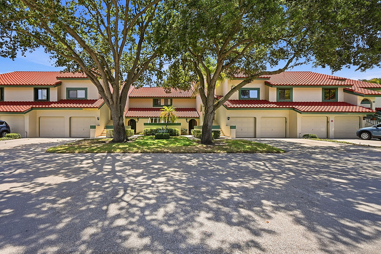 Front at 22 Lexington Lane West Unit D, Palm Beach Gardens, FL 33418, listed by Lori Hobin