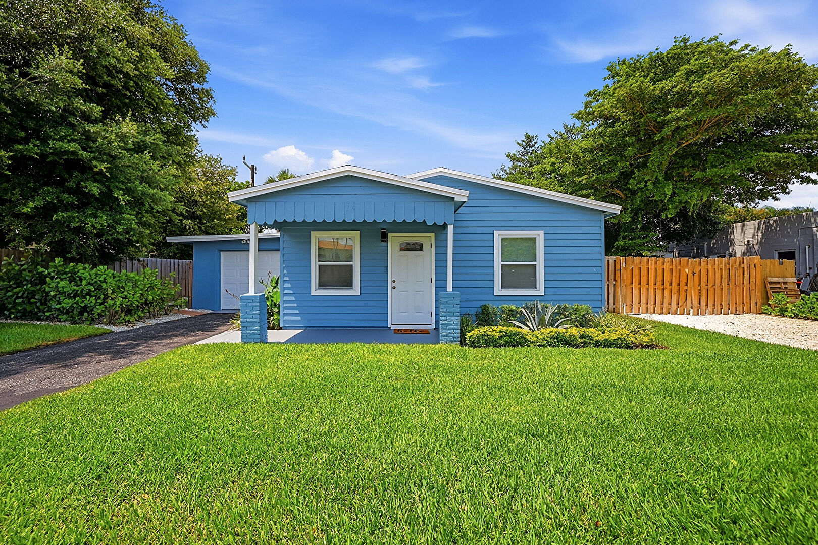 Front yard at 1821 Bomar Drive, North Palm Beach, FL 33408, listed by Bobac (Bobby) Medalian
