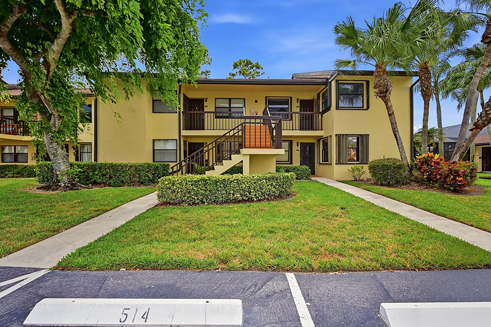 Front at 4699 Lucerne Lakes Boulevard East, Apt #206, Greenacres, FL 33467, listed by Lucia (Lucy) Escobar