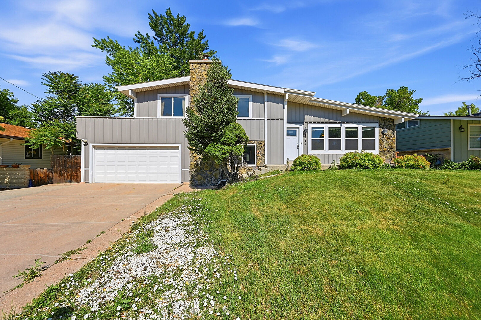 Front at 9547 West Kentucky Drive, Lakewood, CO 80226, listed by Ana Elisa Delgado