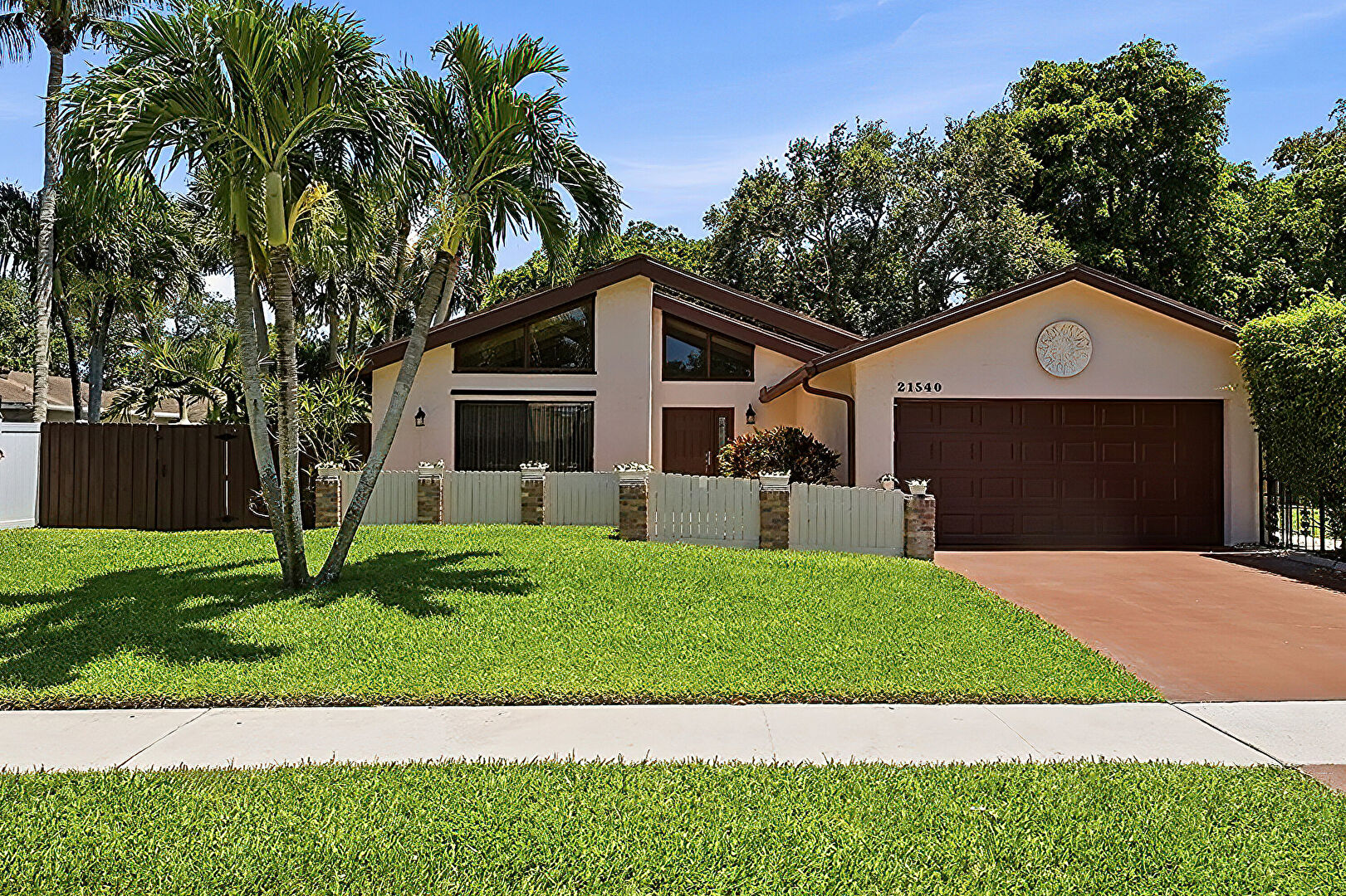Front at 21540 Kapok Circle, Boca Raton, FL 33433, listed by Debbi Lawlor
