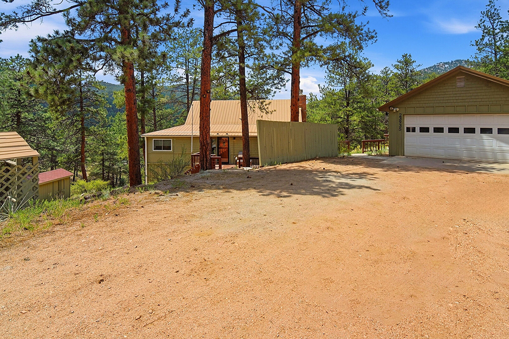 Front at 23935 Hilltop Road, Pine, CO 80470, listed by Cynthia Giffen