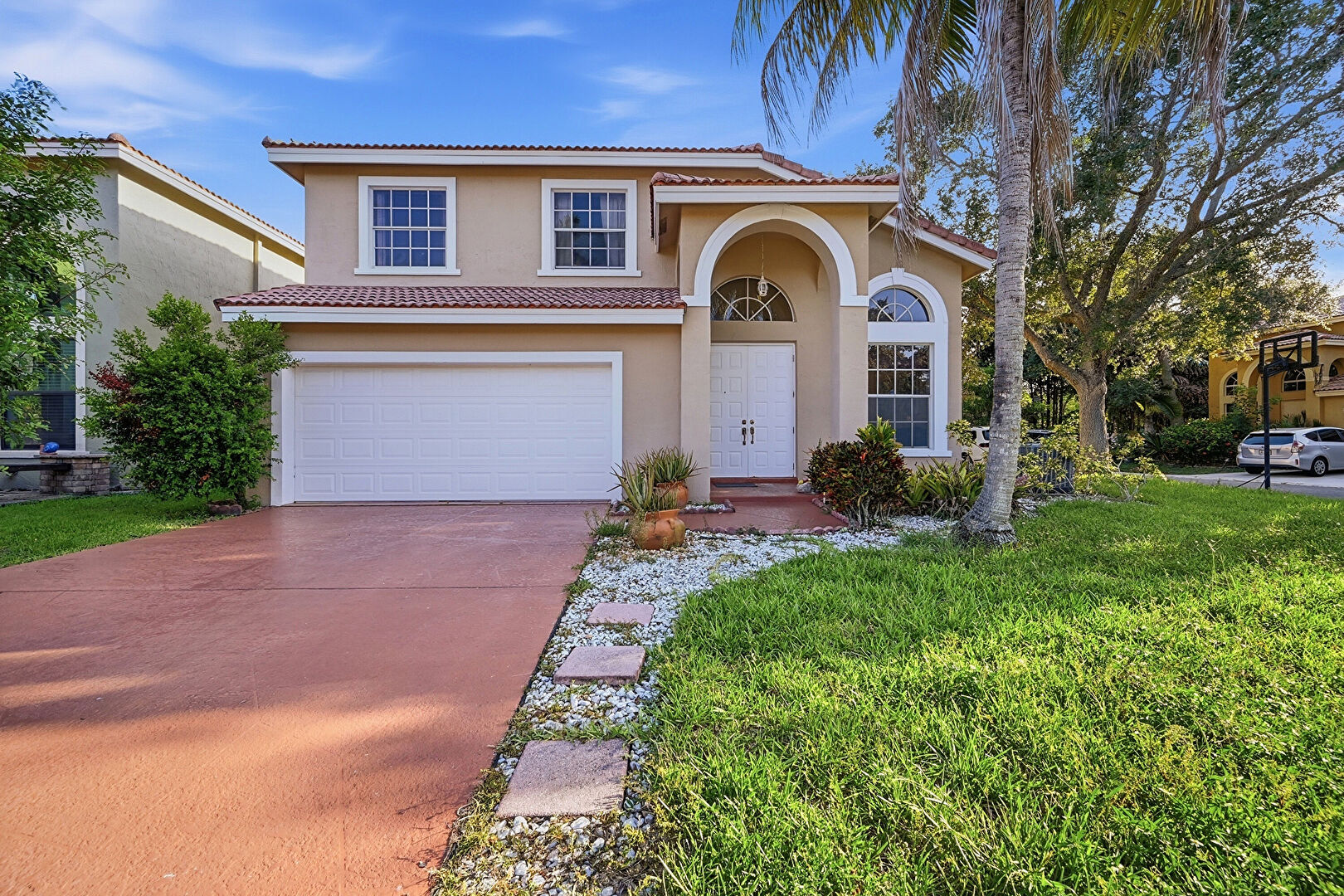 Front at 306 Northwest 115th Way, Coral Springs, FL 33071, listed by Laura Sanders