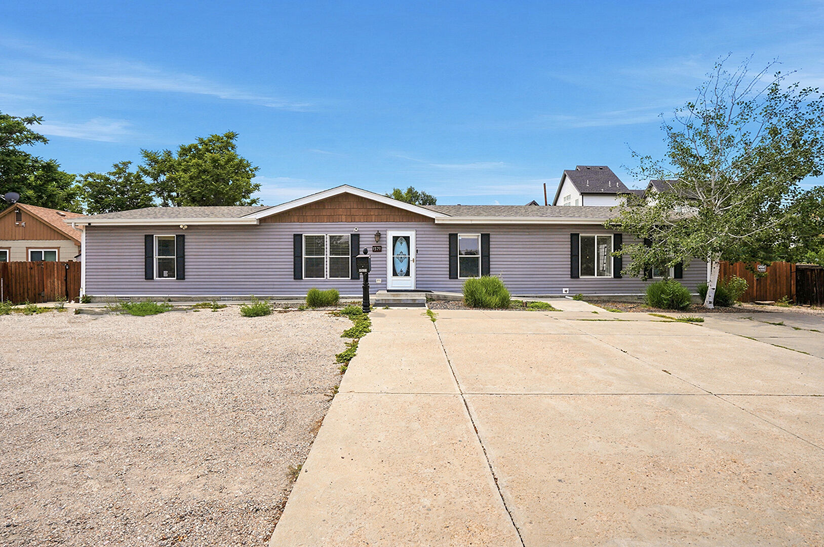 Front at 1571 Sheridan Blvd, Lakewood, CO 80232, listed by Julie Leins