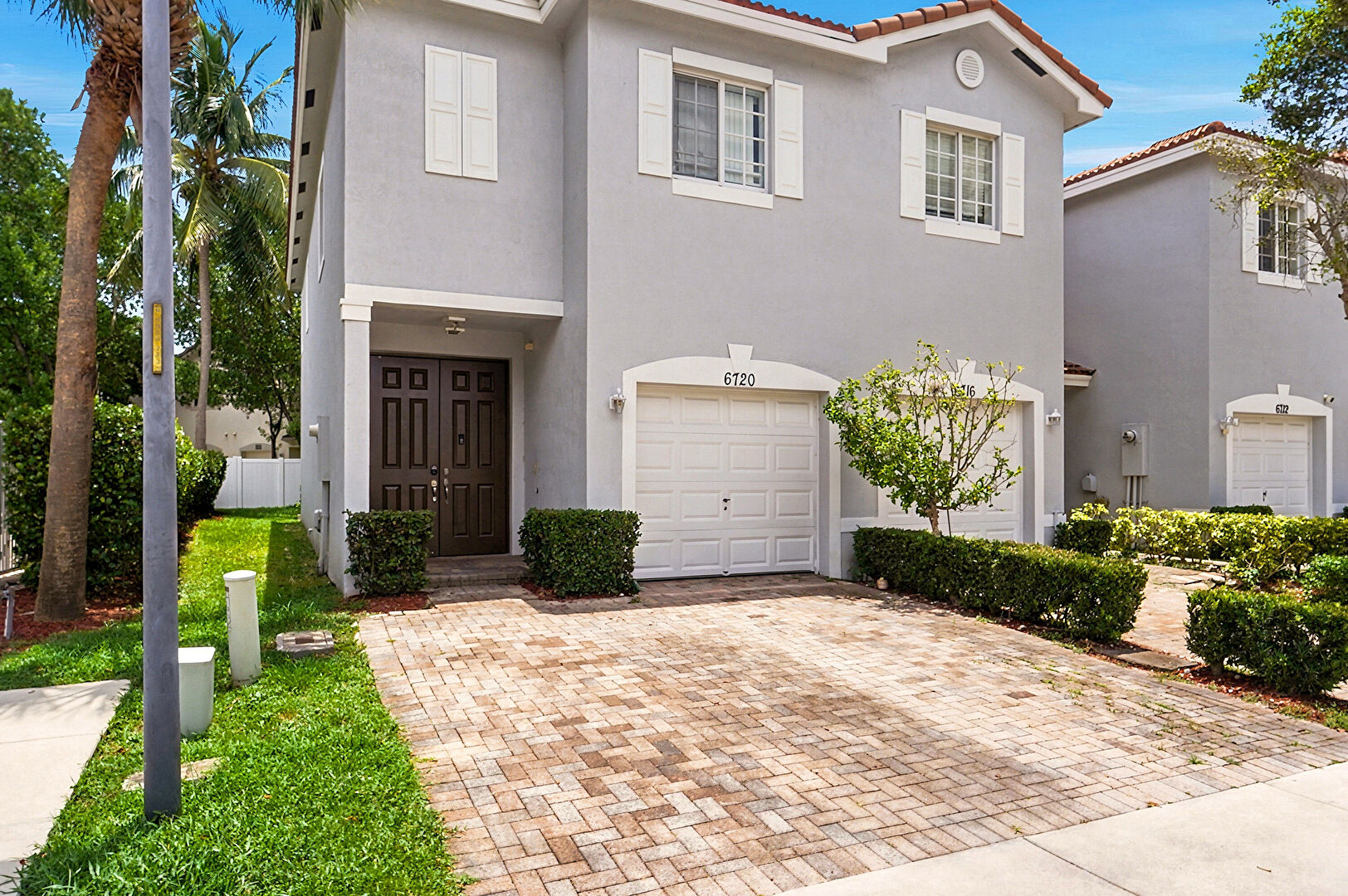 Front at 6720 Cypress Walk Terrace, Tamarac, FL 33321, listed by Frieda Heller