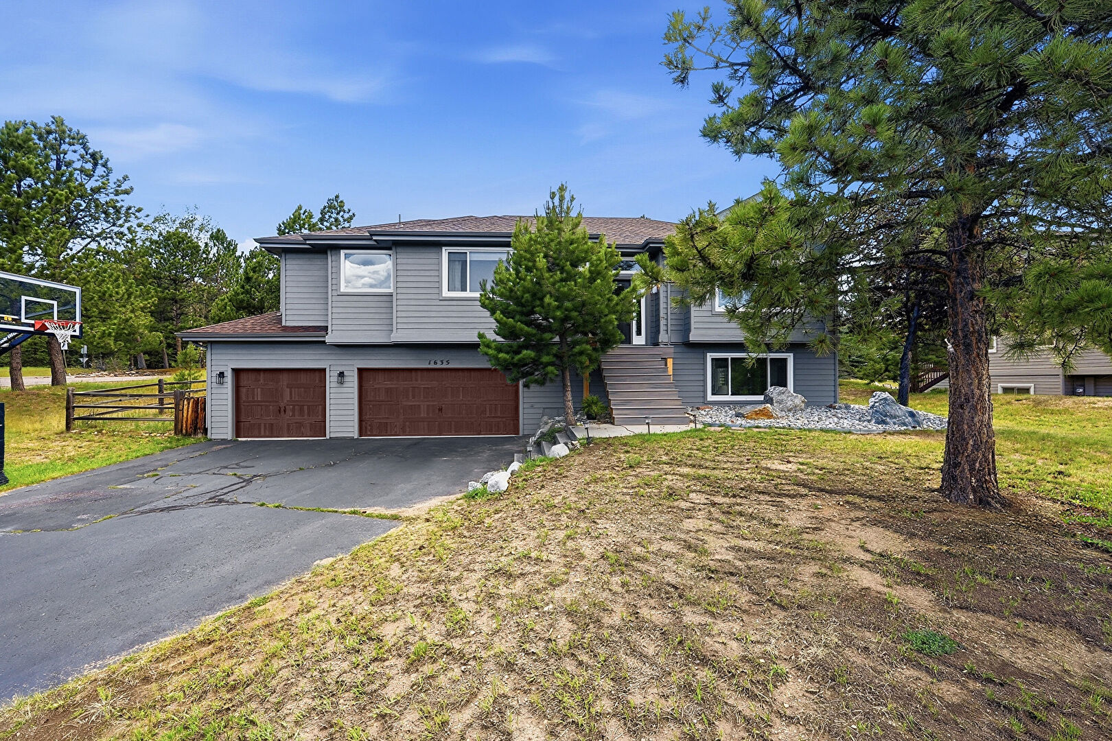 Front at 1635 Muirfield Lane, Evergreen, CO 80439, listed by Sandra Bosworth
