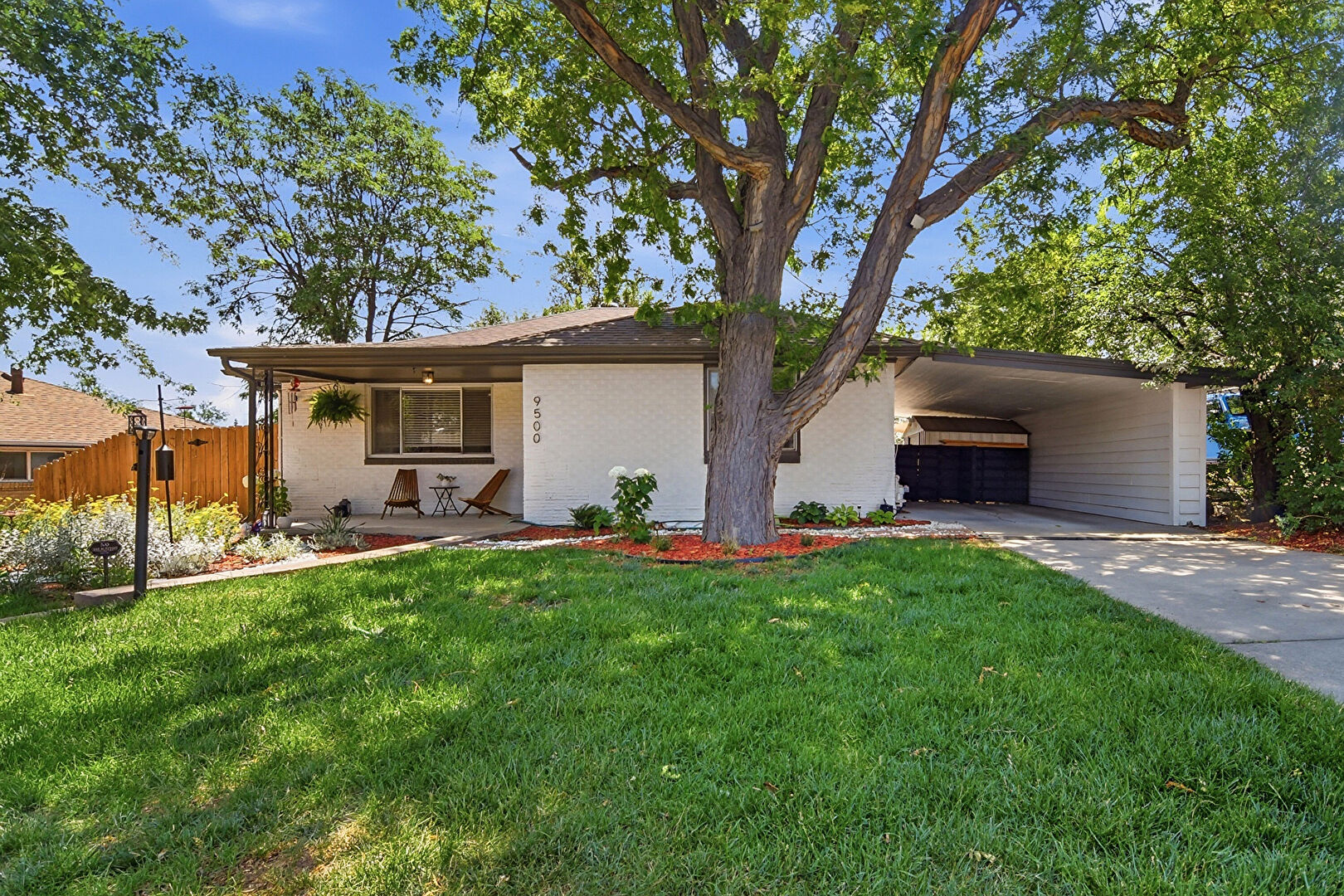 Front at 9500 West 54th Place, Arvada, CO 80002, listed by Jim Casey