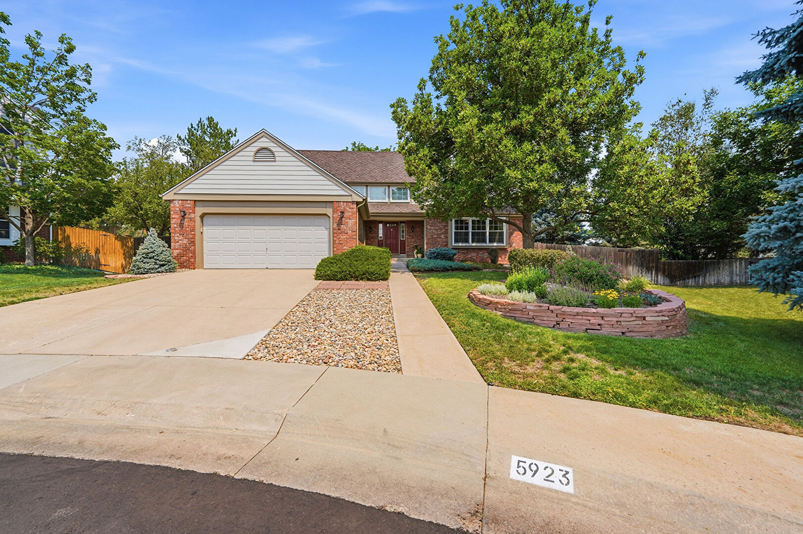 Front at 5923 East Irwin Place, Centennial, CO 80112, listed by Eric Johnson