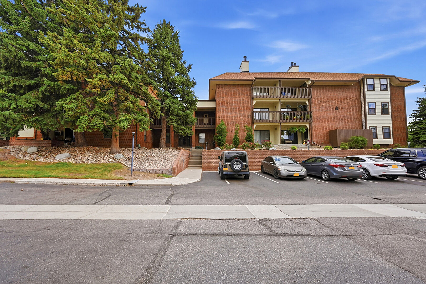 Front at 13950 East Oxford Place, A210, Aurora, CO 80014, listed by Greg Livingston