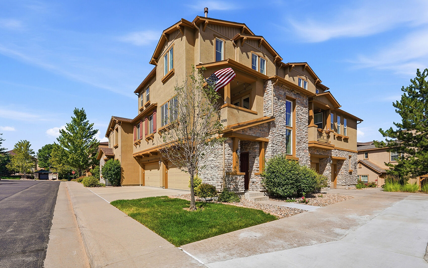 Front at 10549 Graymont Lane, #14D, Highlands Ranch, CO 80126, listed by Tom Richardson