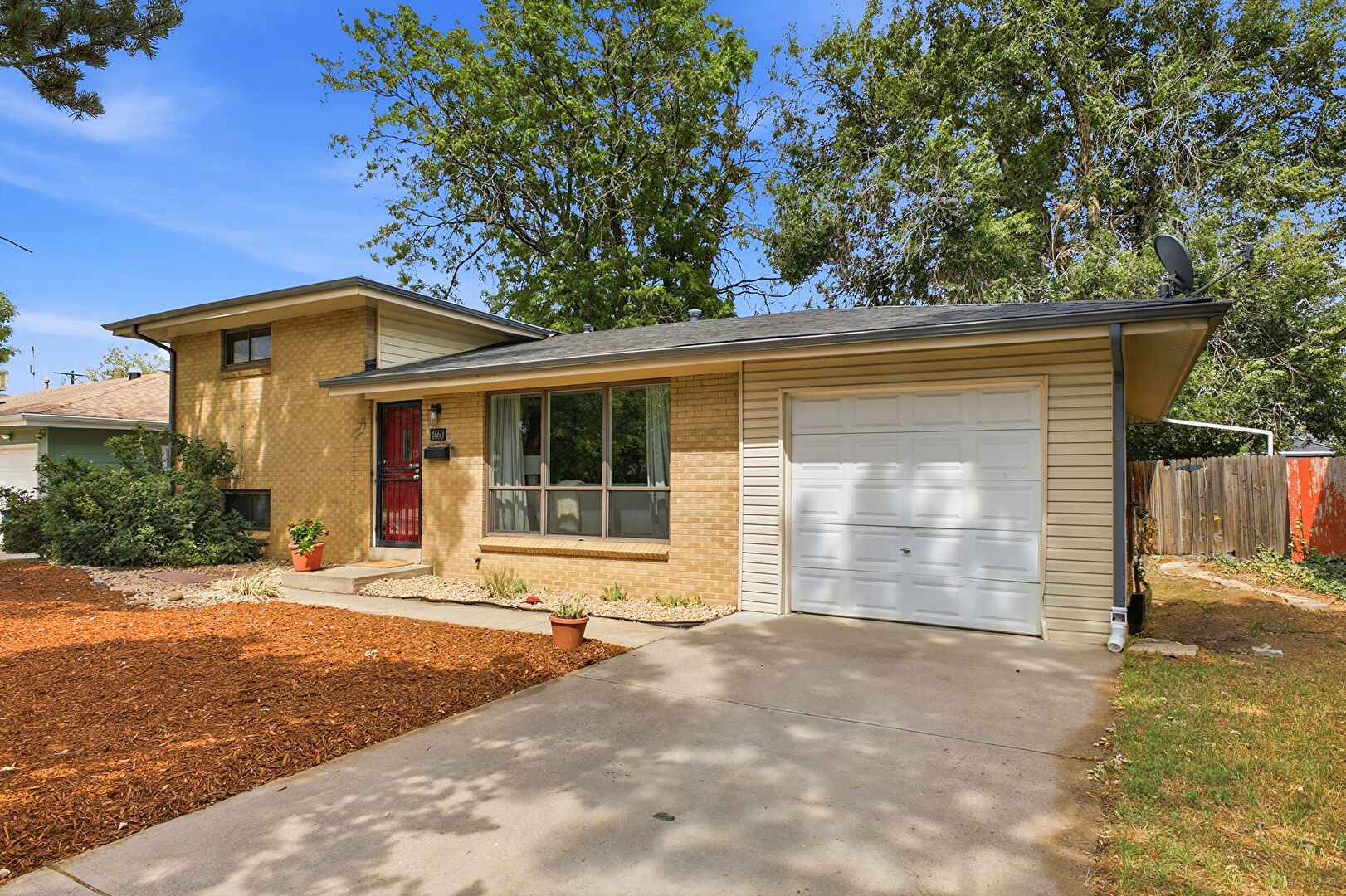 Front at 4660 Estes Street, Wheat Ridge, CO 80033, listed by Jennifer Steinert