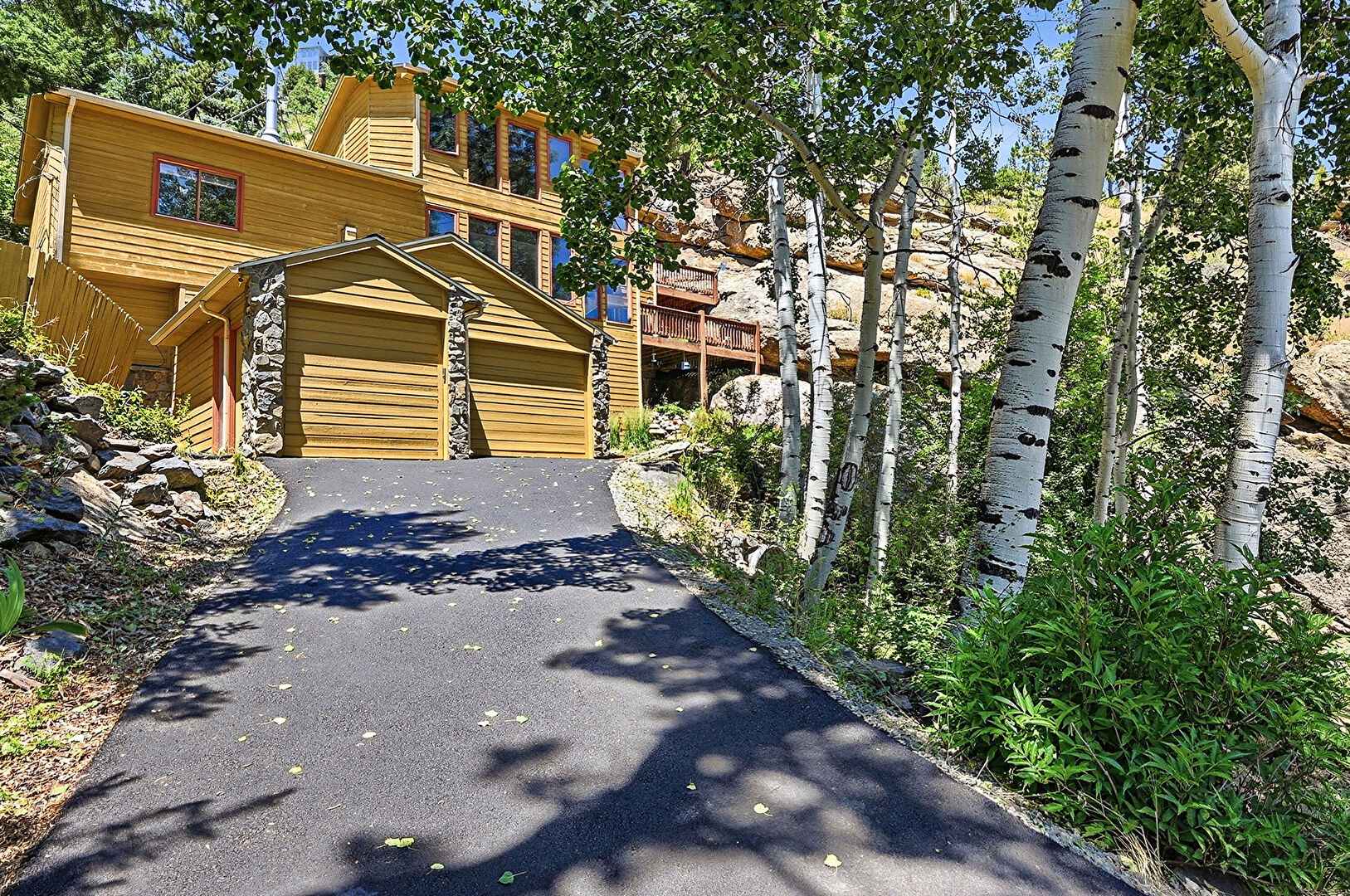 Front at 551 Aspen Drive, Evergreen, CO 80439, listed by Kimberly Burns