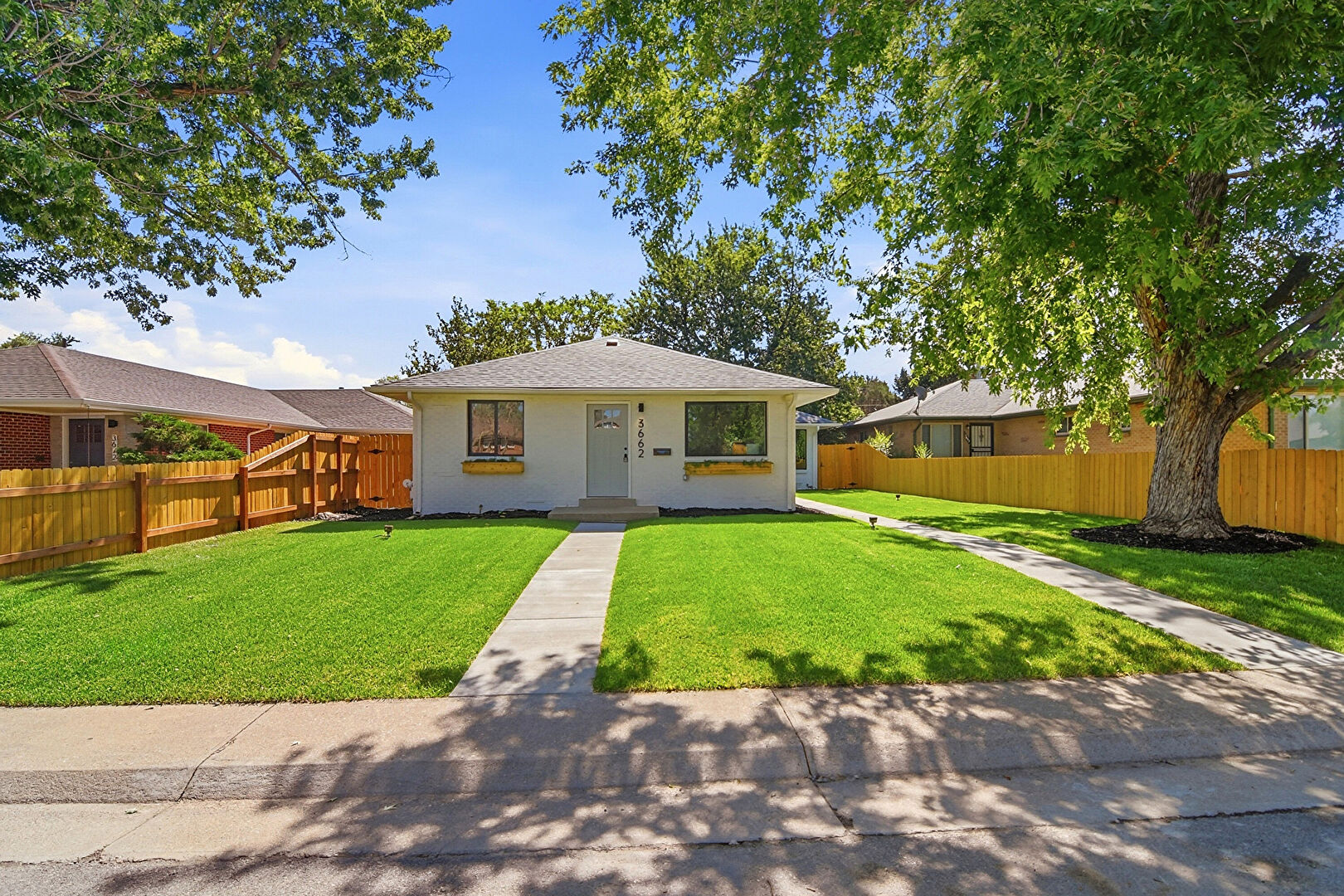 Front at 3662 Grape Street, Denver, CO 80207, listed by Shawn Kane