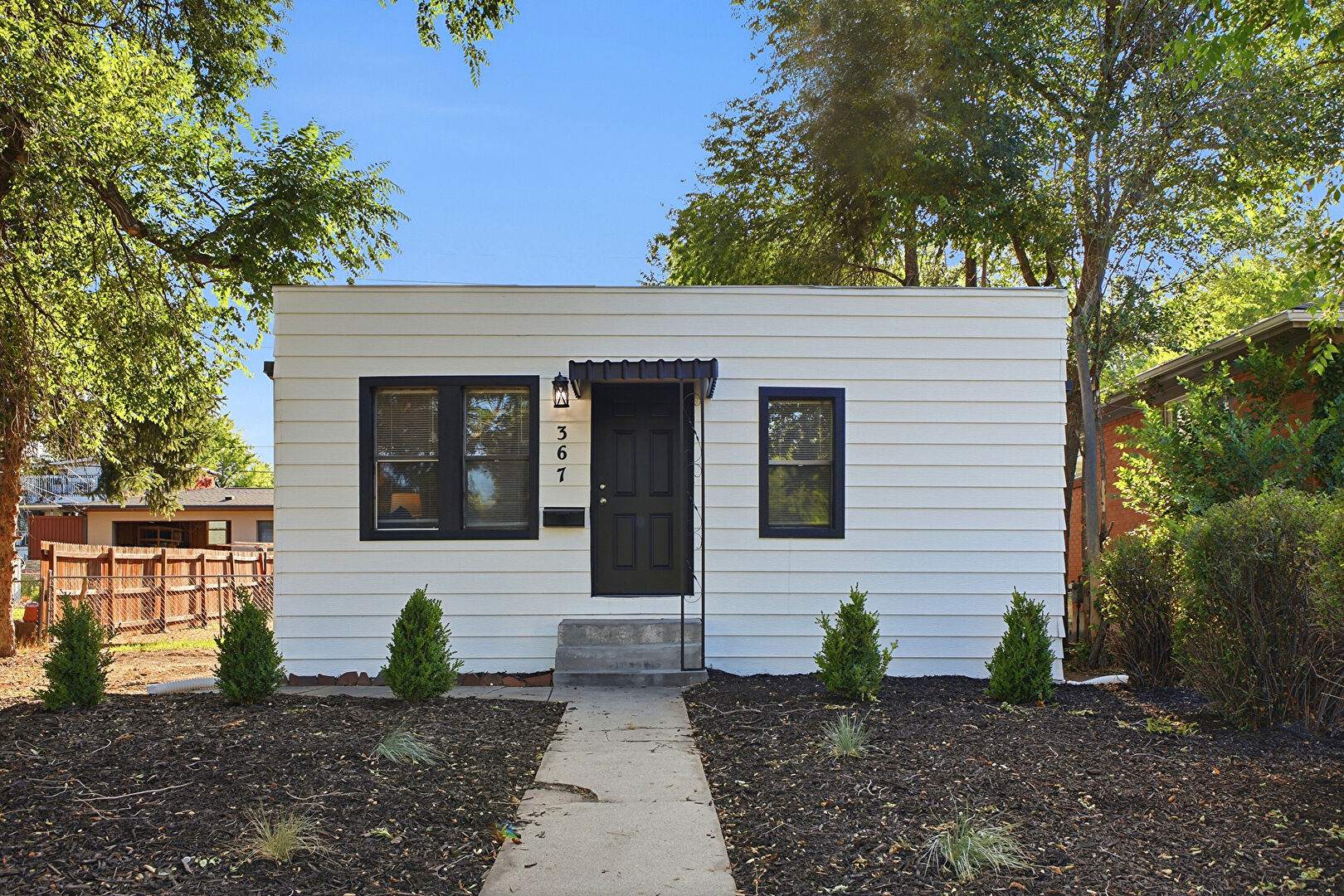 Front at 367 South Jasmine Street, Denver, CO 80224, listed by Andria and Eric Stashak