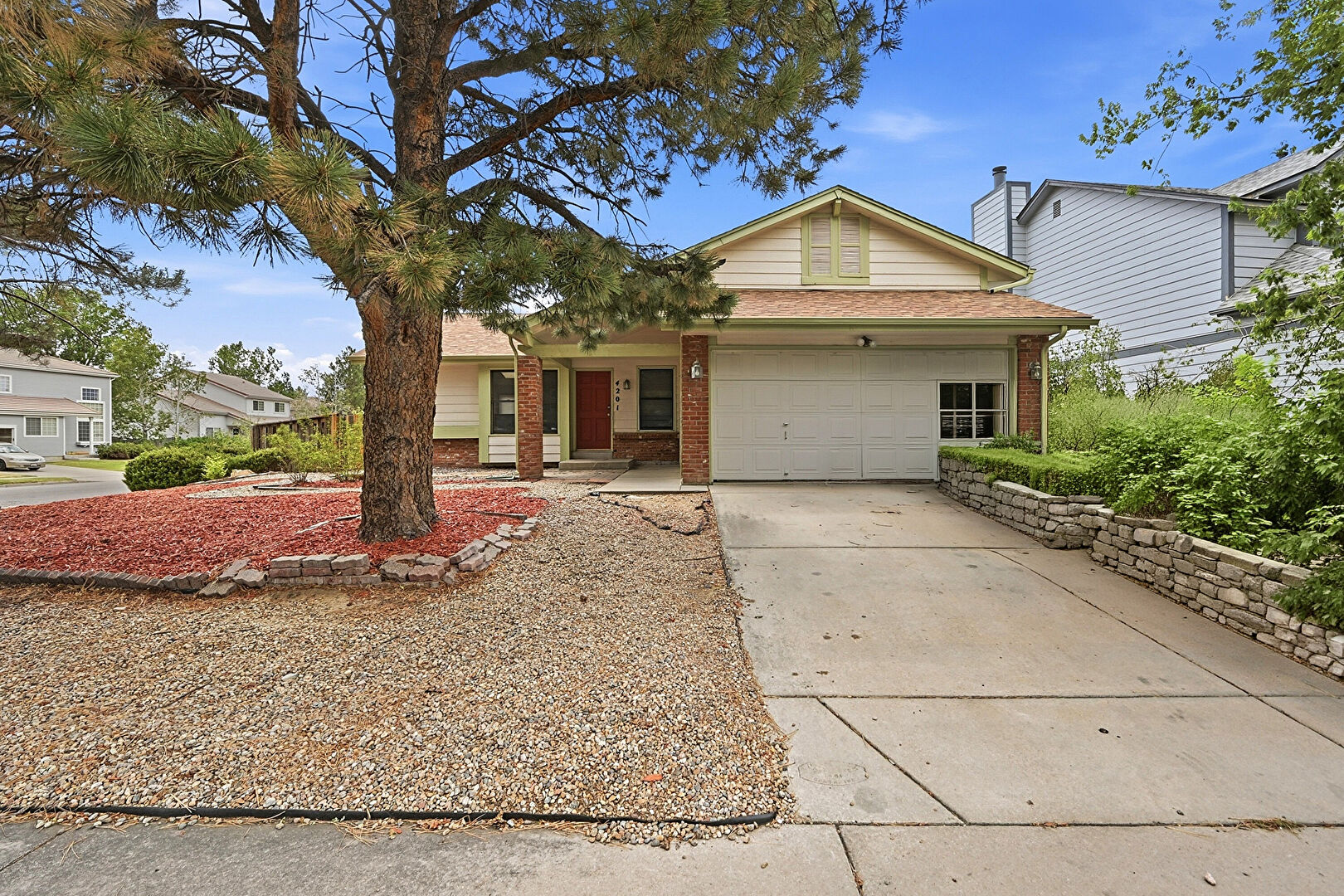 Front at 4201 Ireland Street, Denver, CO 80249, listed by Andria and Eric Stashak